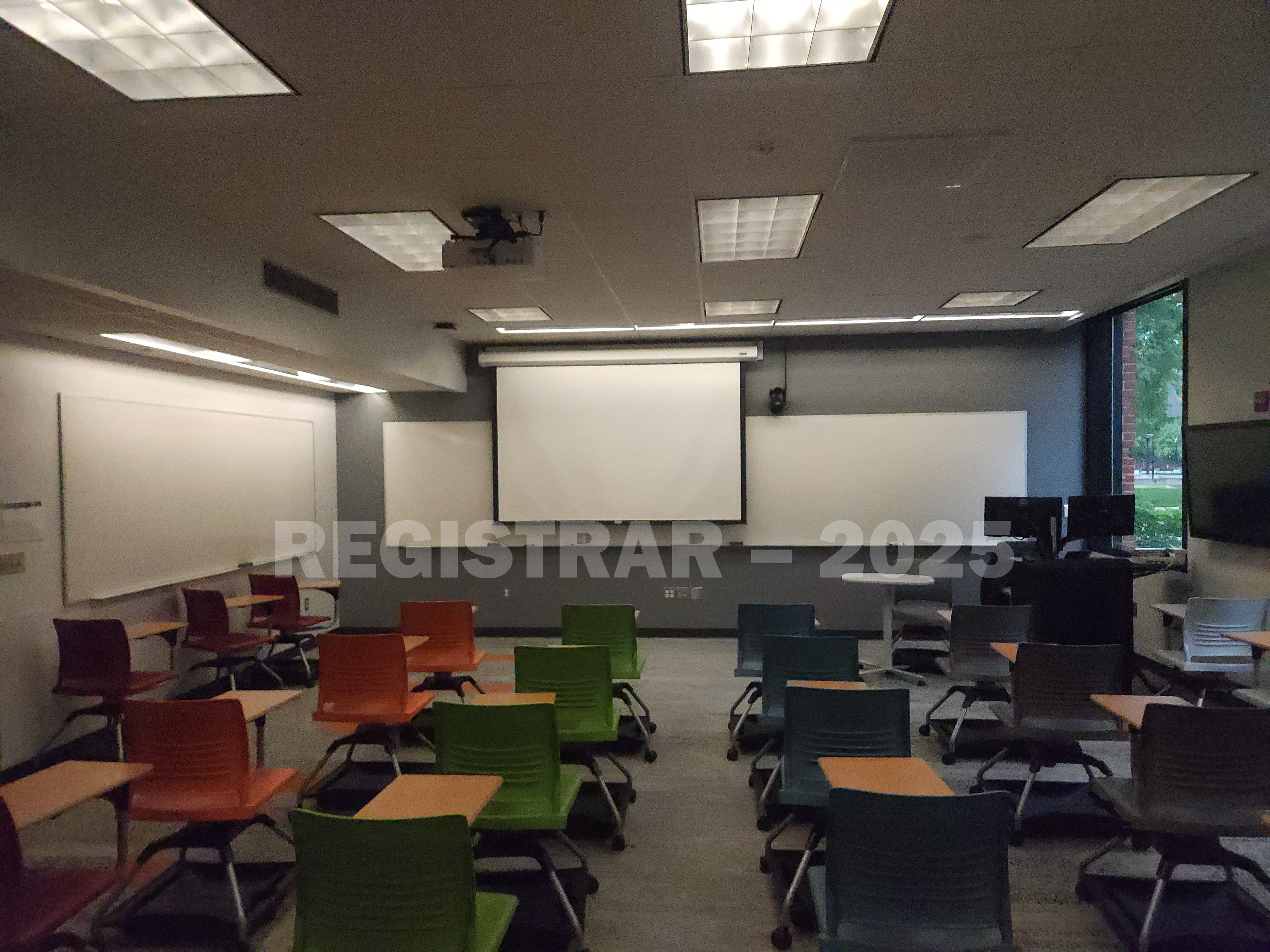 McPherson Chemical Lab room 1045 view from the back of the room with projection screen down