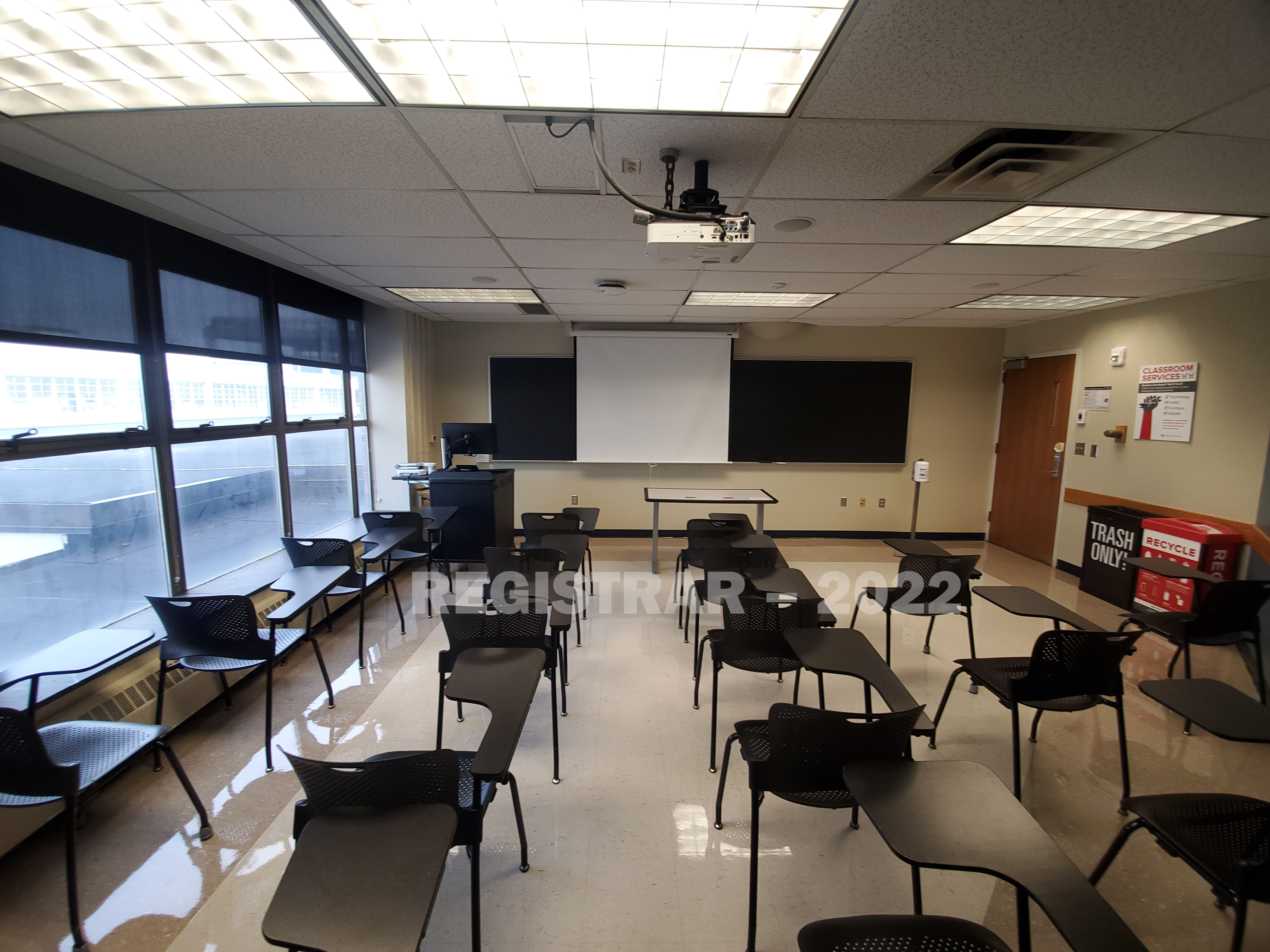 Enarson Classroom Building room 248 ultra wide angle view from the back of the room with projector screen down