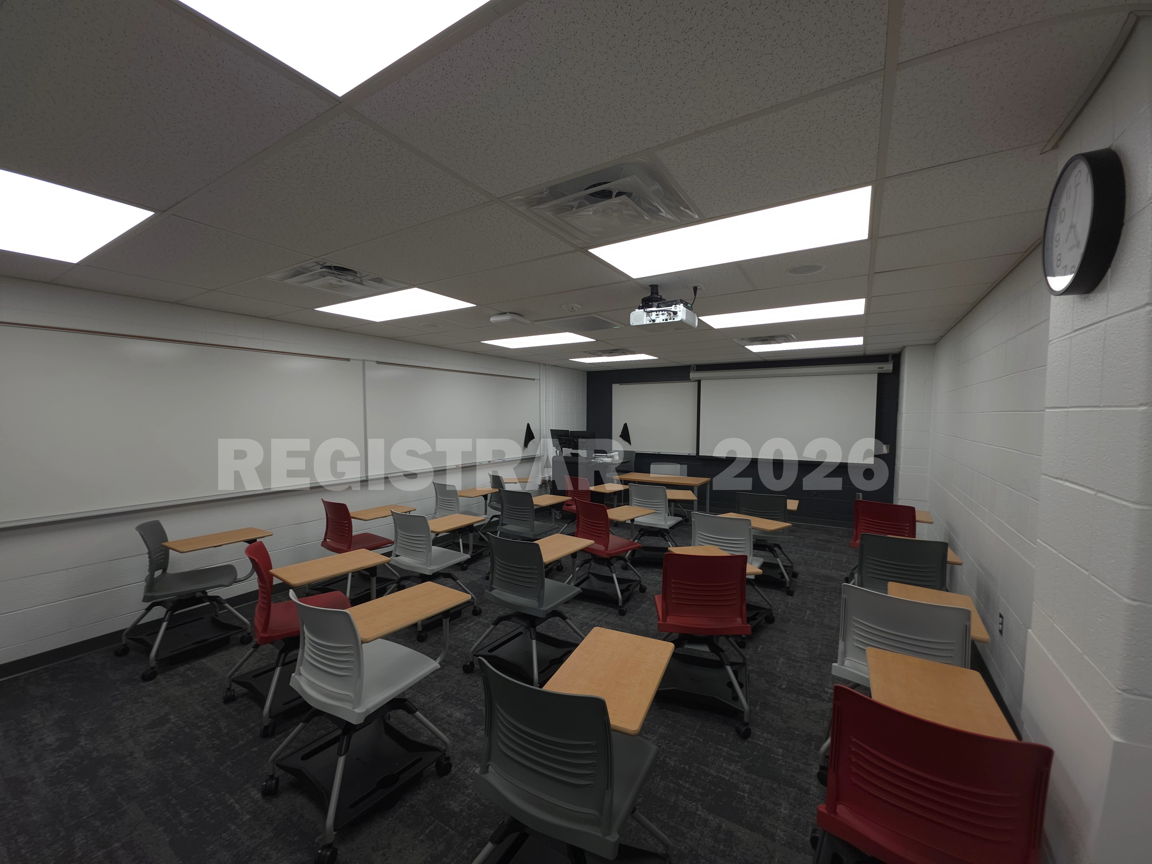 University Hall room 37 ultra wide angle view of back of room with projection screen down