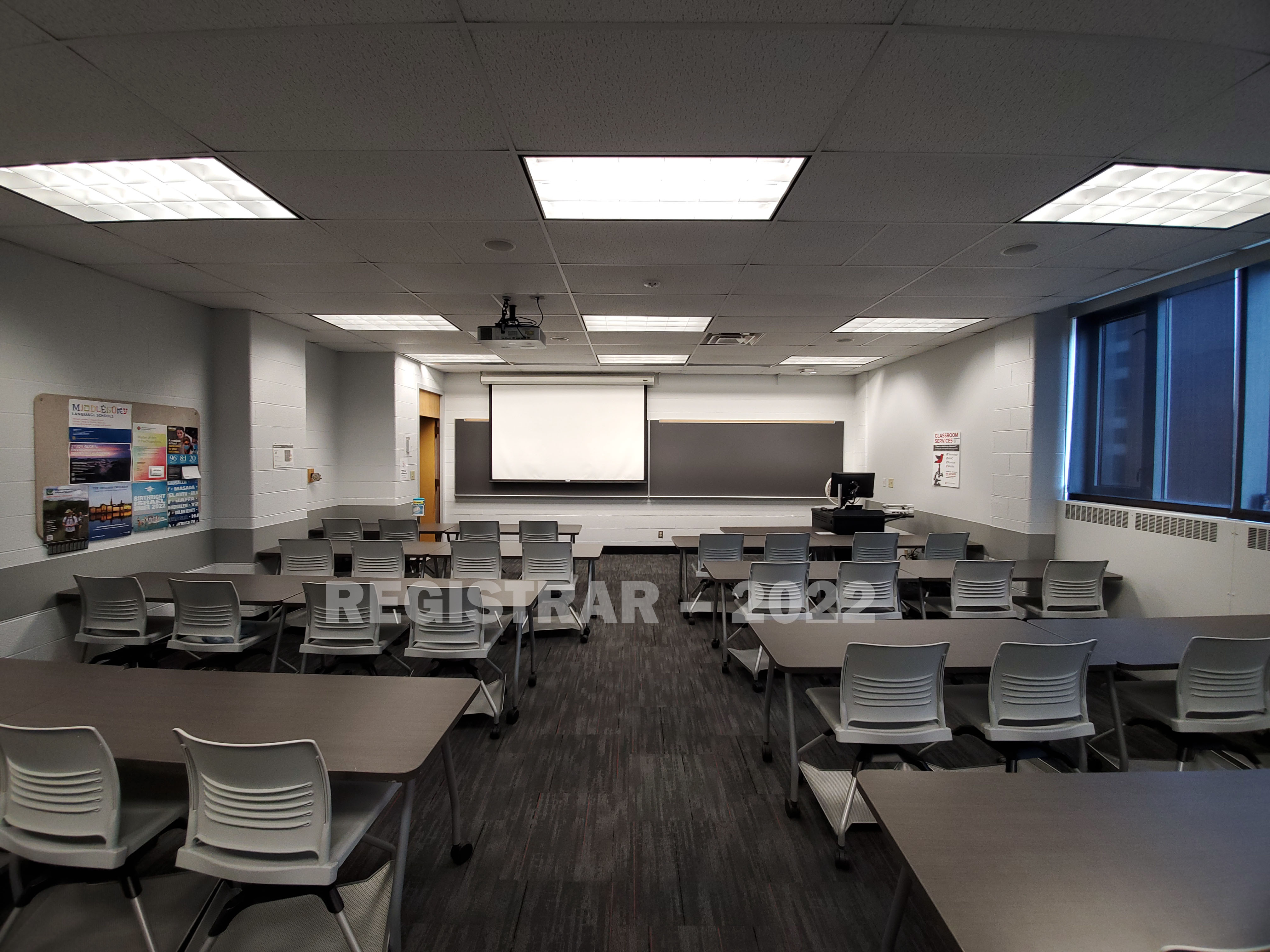 Bolz Hall room 314 ultra wide angle view from the back of the room with projector screen down