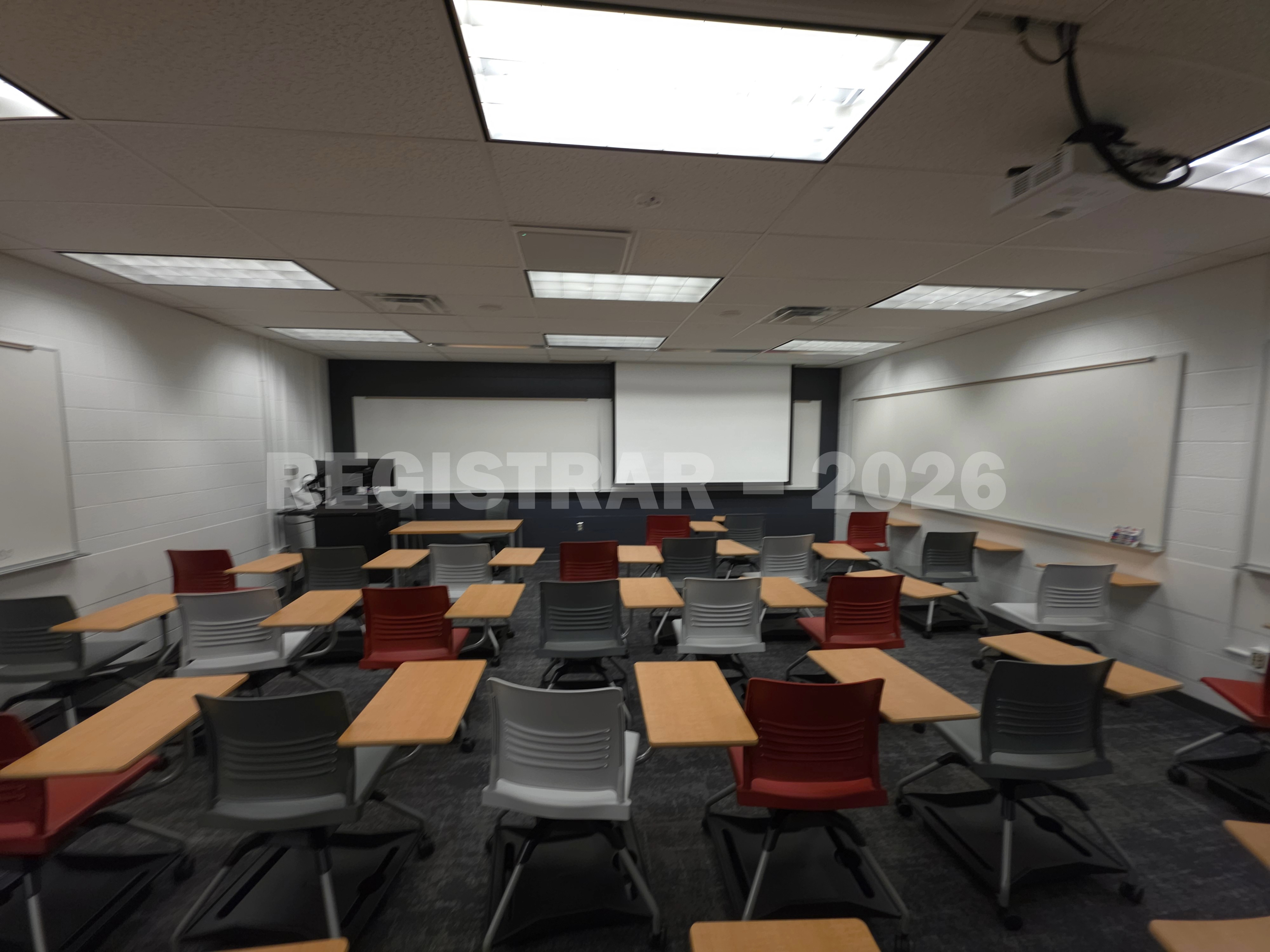 University Hall room 47 back of room projection screen down ultra wide angle view