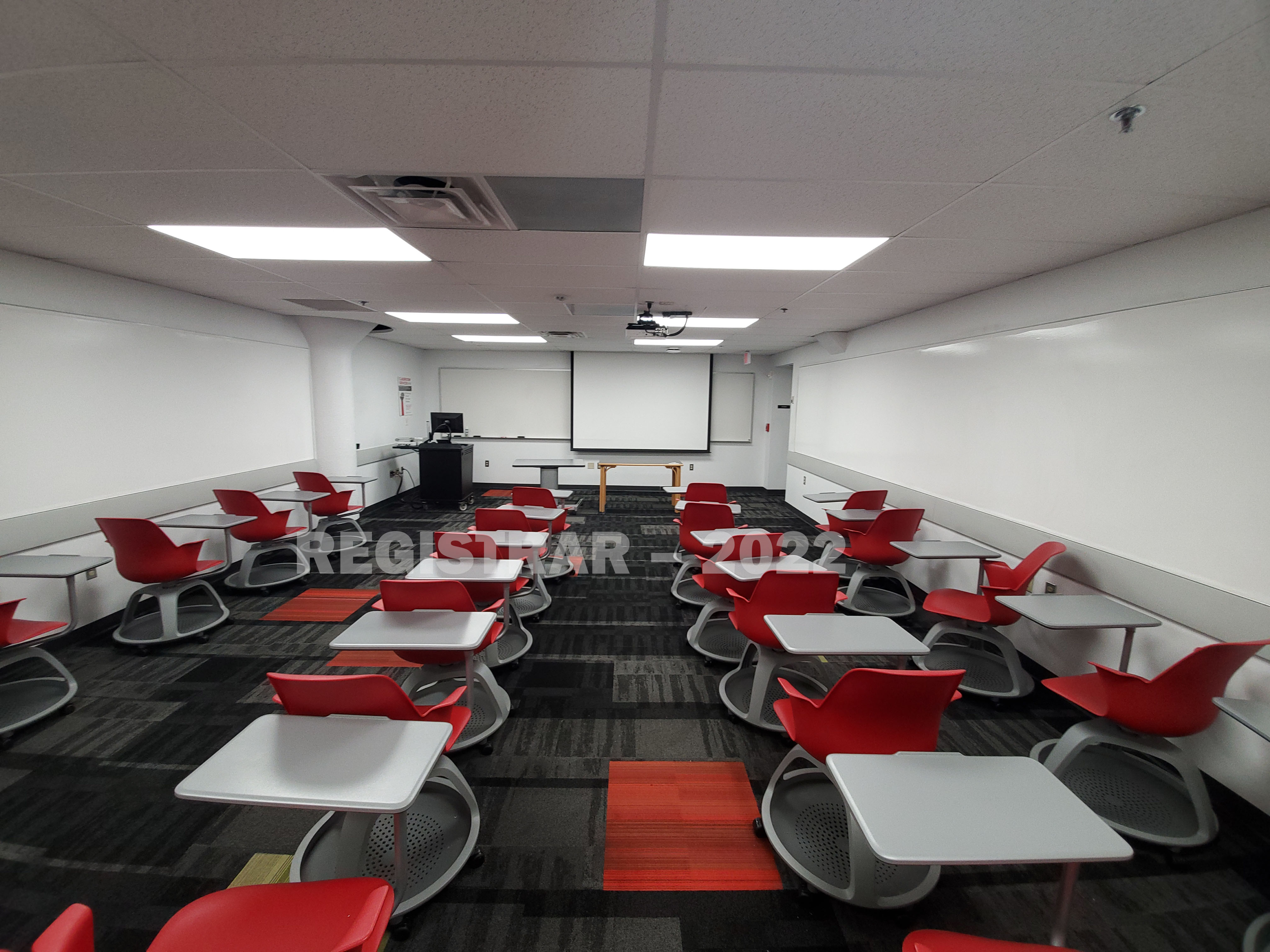 Enarson Classroom Building room 17 ultra wide angle view from the back of the room with projector screen down
