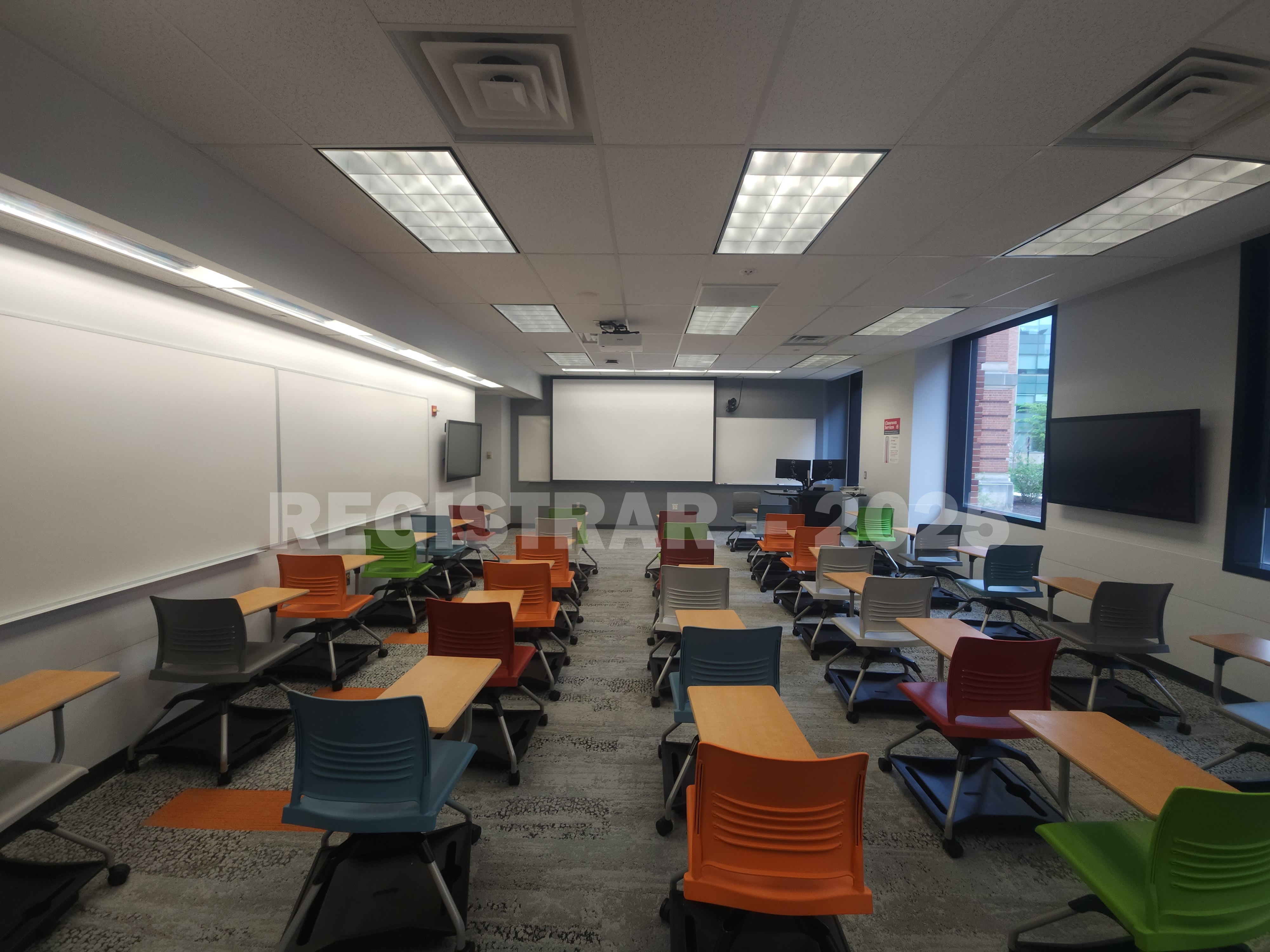 McPherson Chemical Lab room 1046 ultra wide view from the back of the room with projection screen down