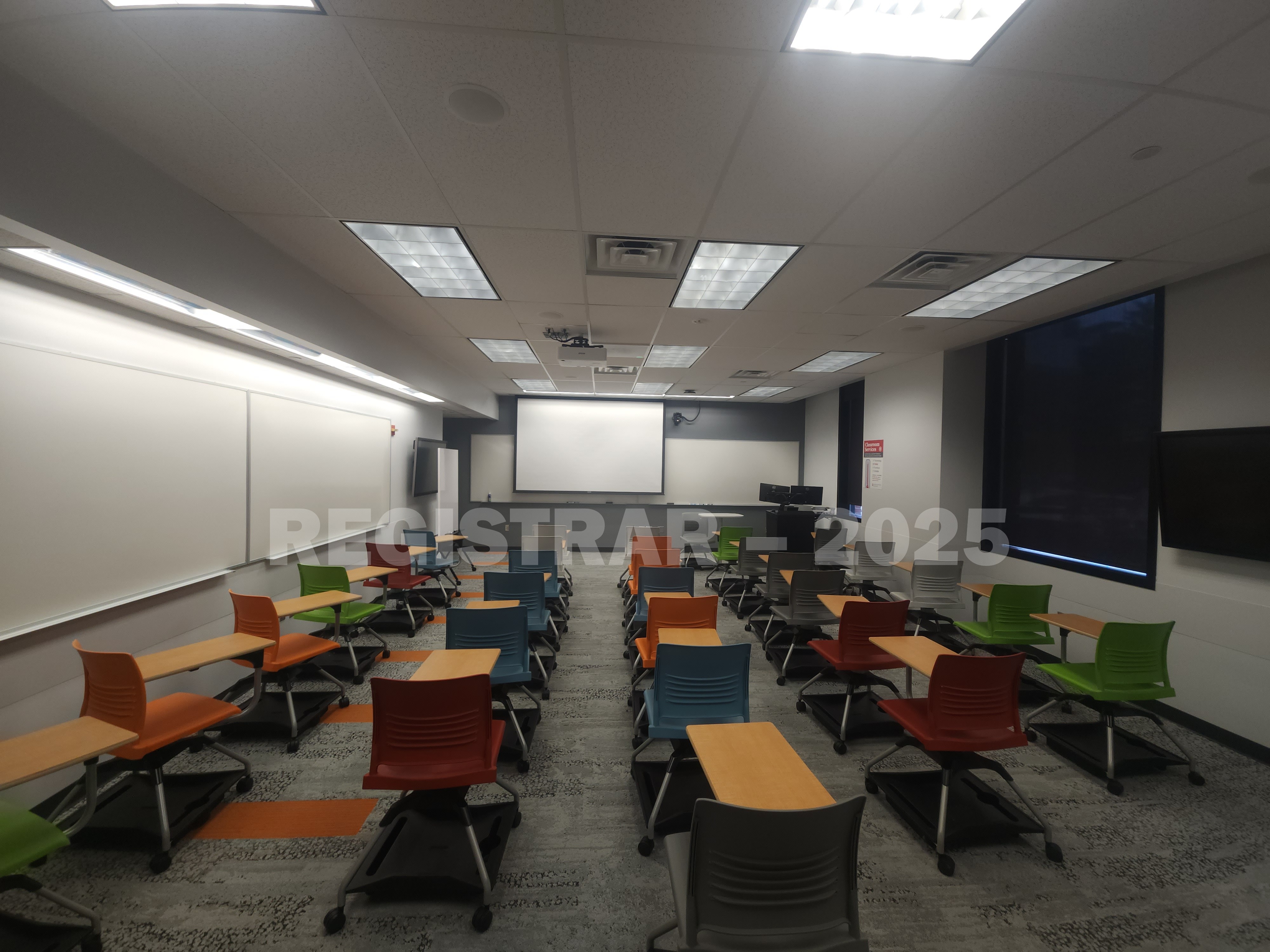 McPherson Chemical Lab room 1040 ultra wide view from the back of the room with projection screen down