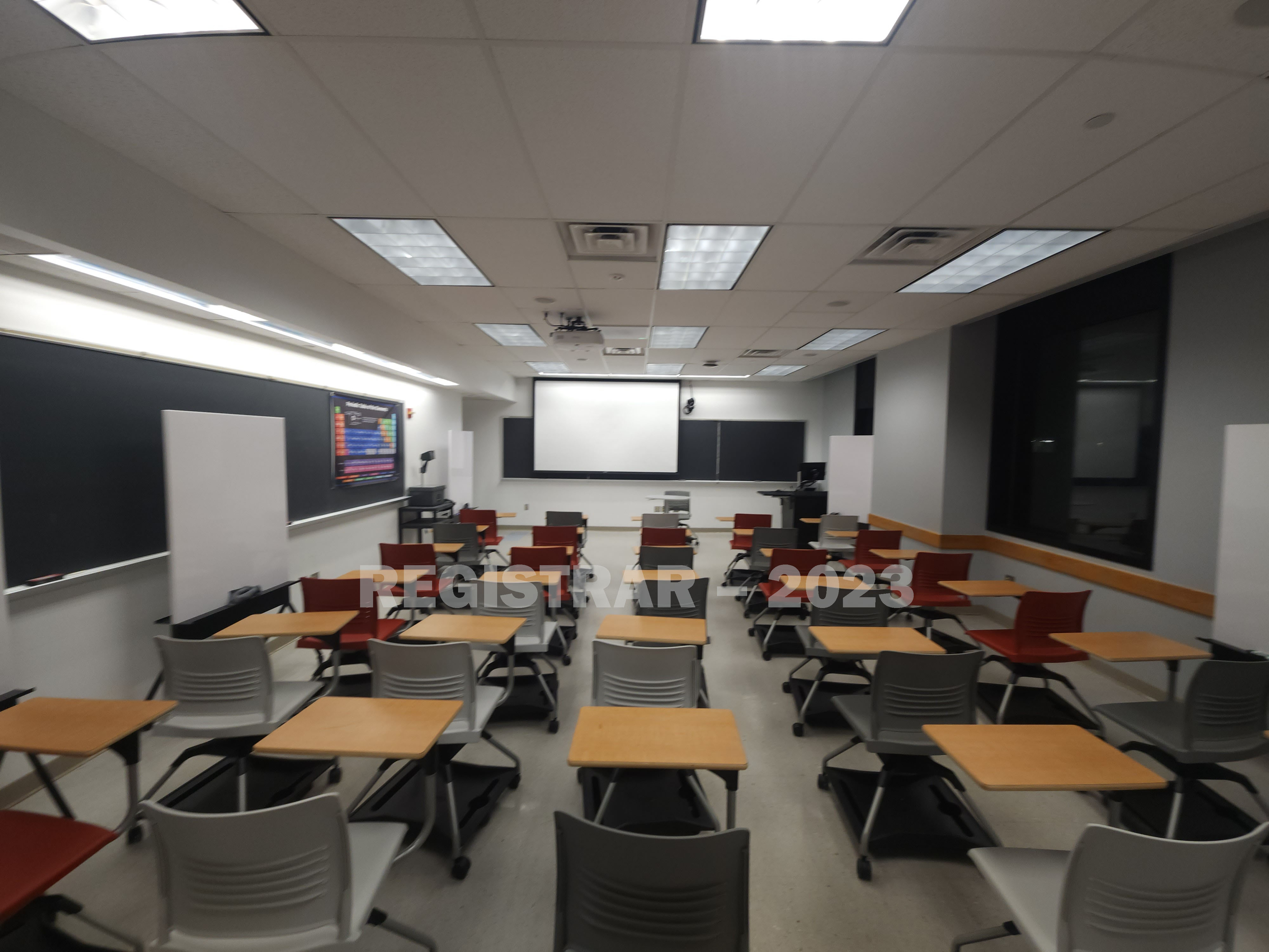 McPherson Chemical Lab room 1040 ultra wide view from the back of the room with projection screen down