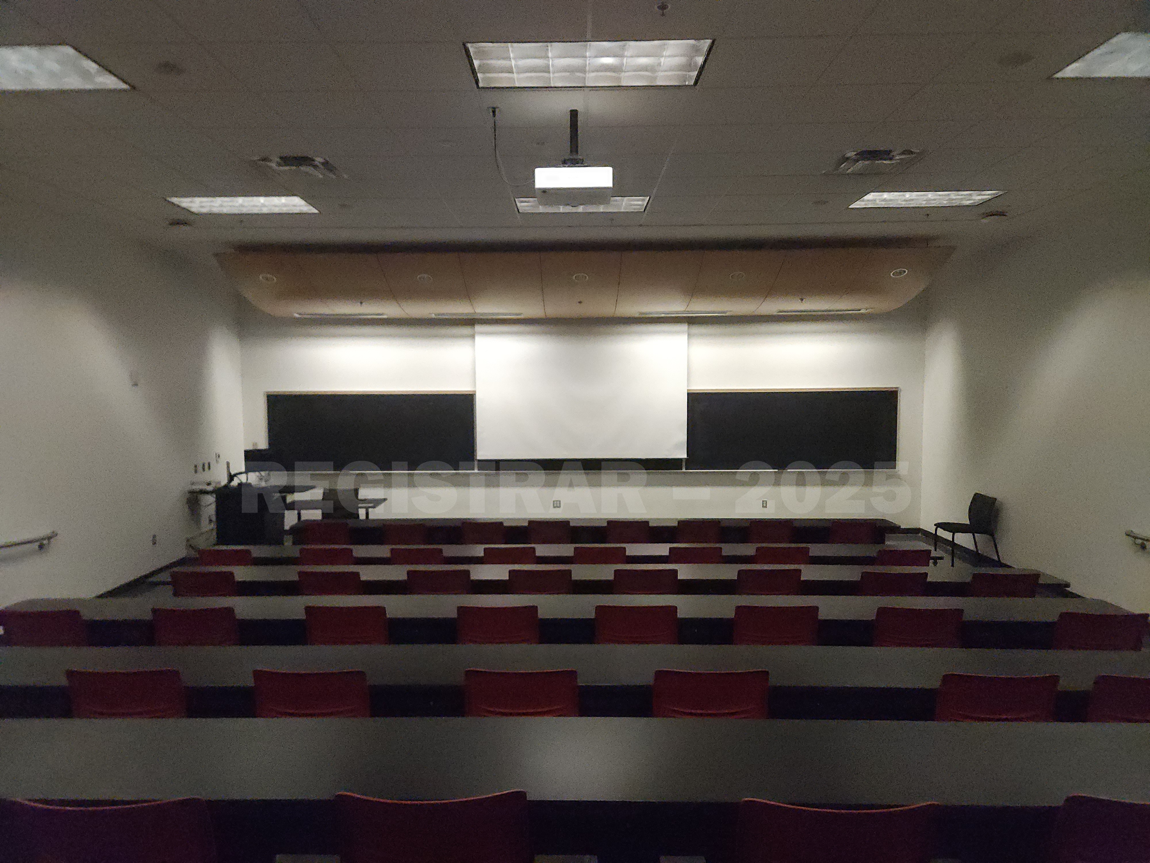 Scott Lab room North 48 view from the back of the room with projector screen down