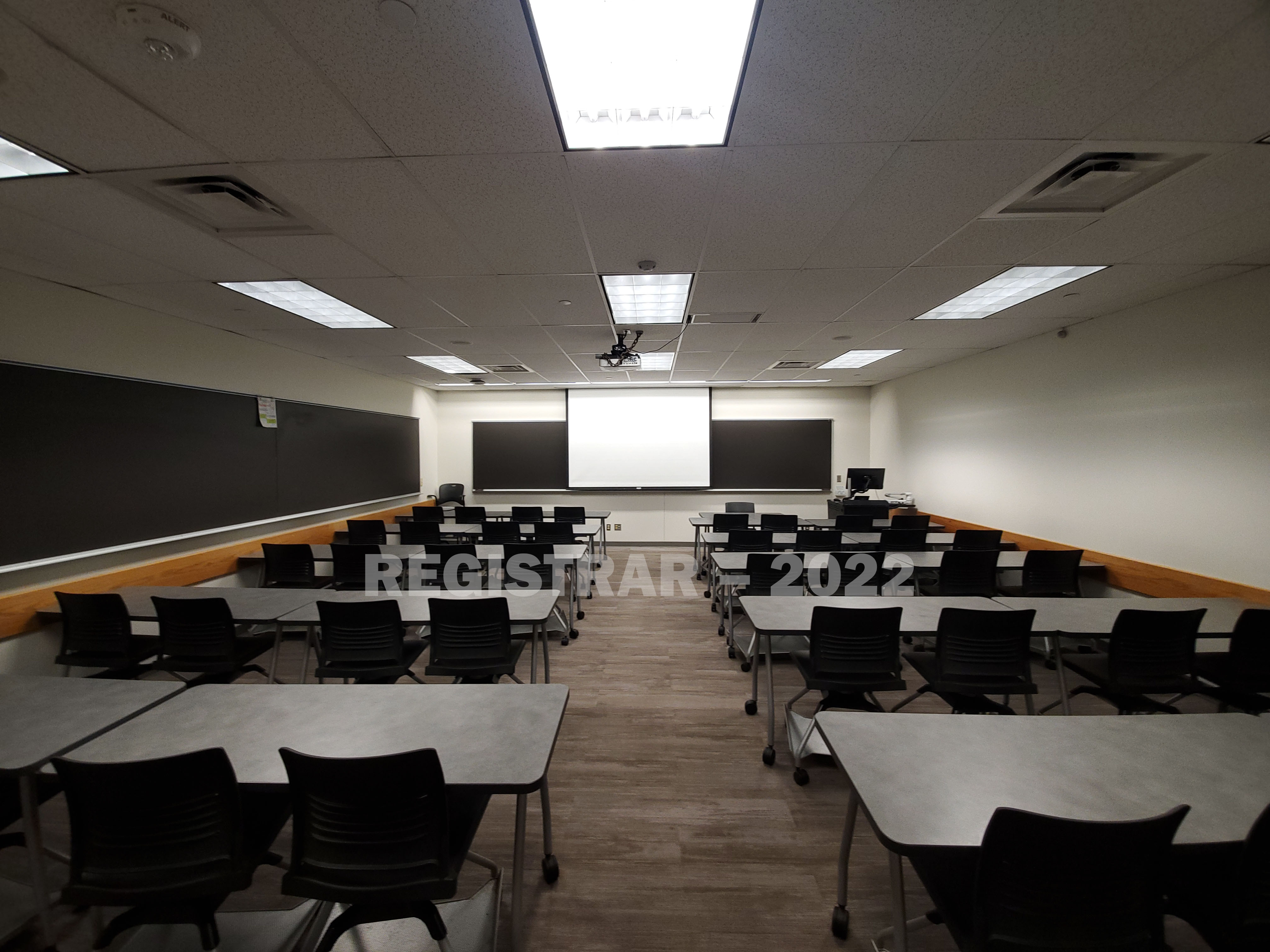 Dreese Lab room 266 ultra wide angle view from the back of the room with projector screen down