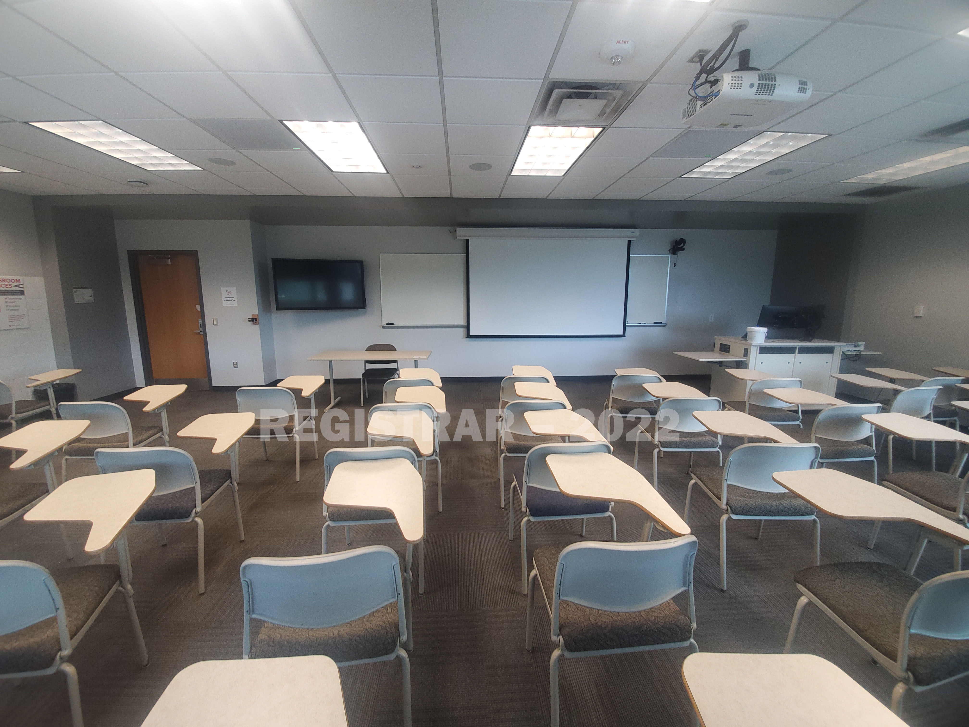Agricultural Administration room 246 ultra wide angle view from the back of the room with projector screen down
