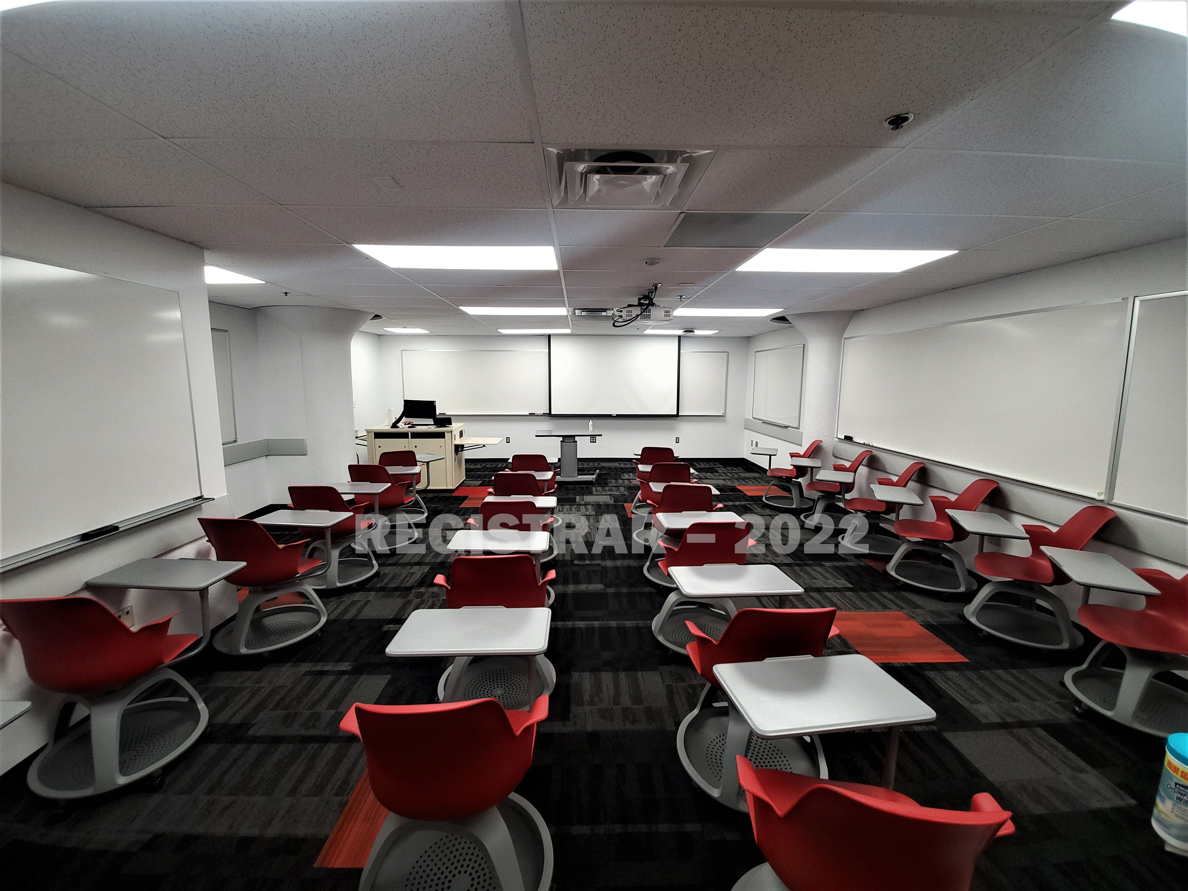 Enarson Classroom Building room 15 ultra wide angle view from the back of the room with projector screen down