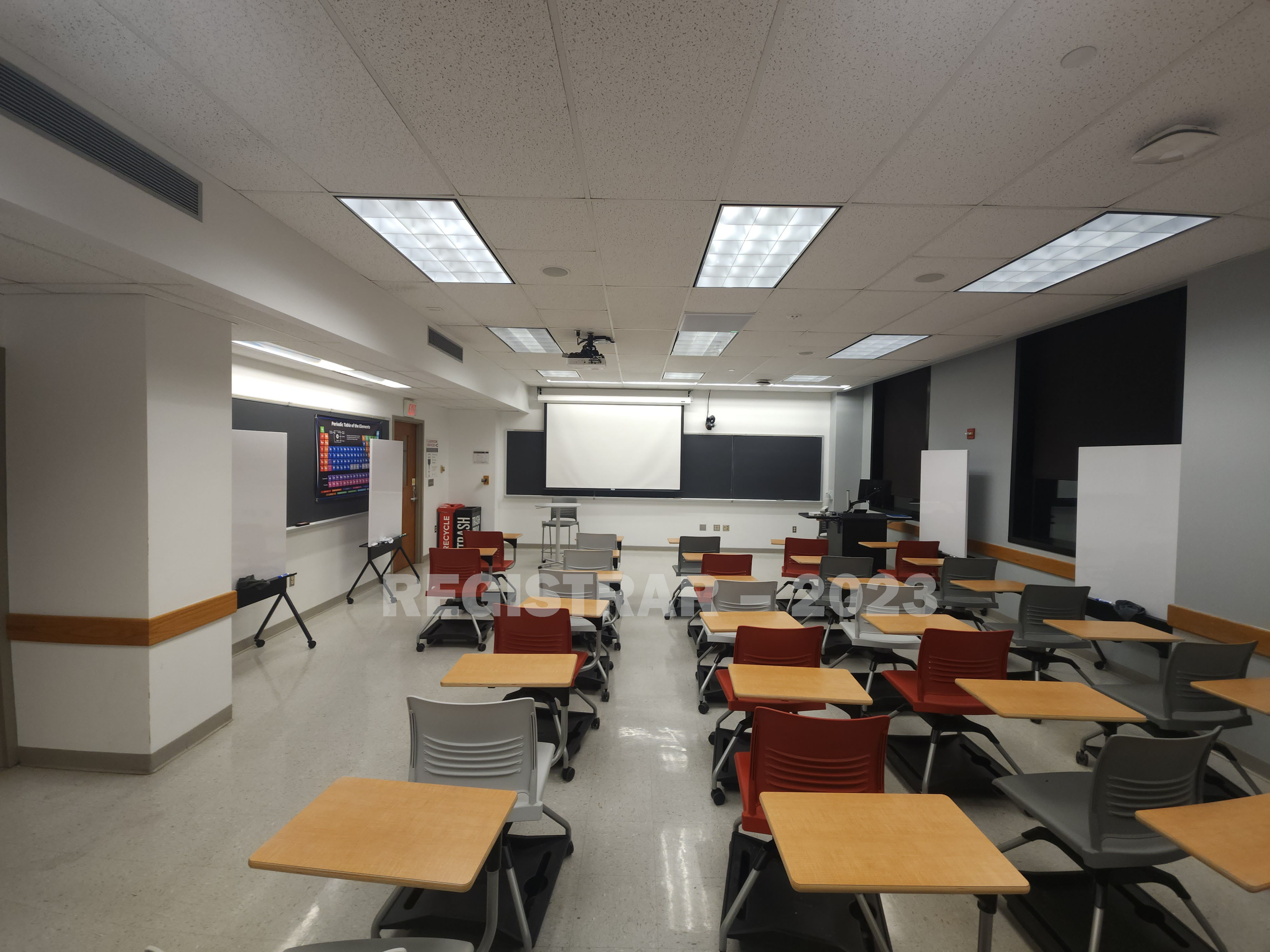 McPherson Chemical Lab room 1035 ultra wide view from the back of the room with the projection screen down
