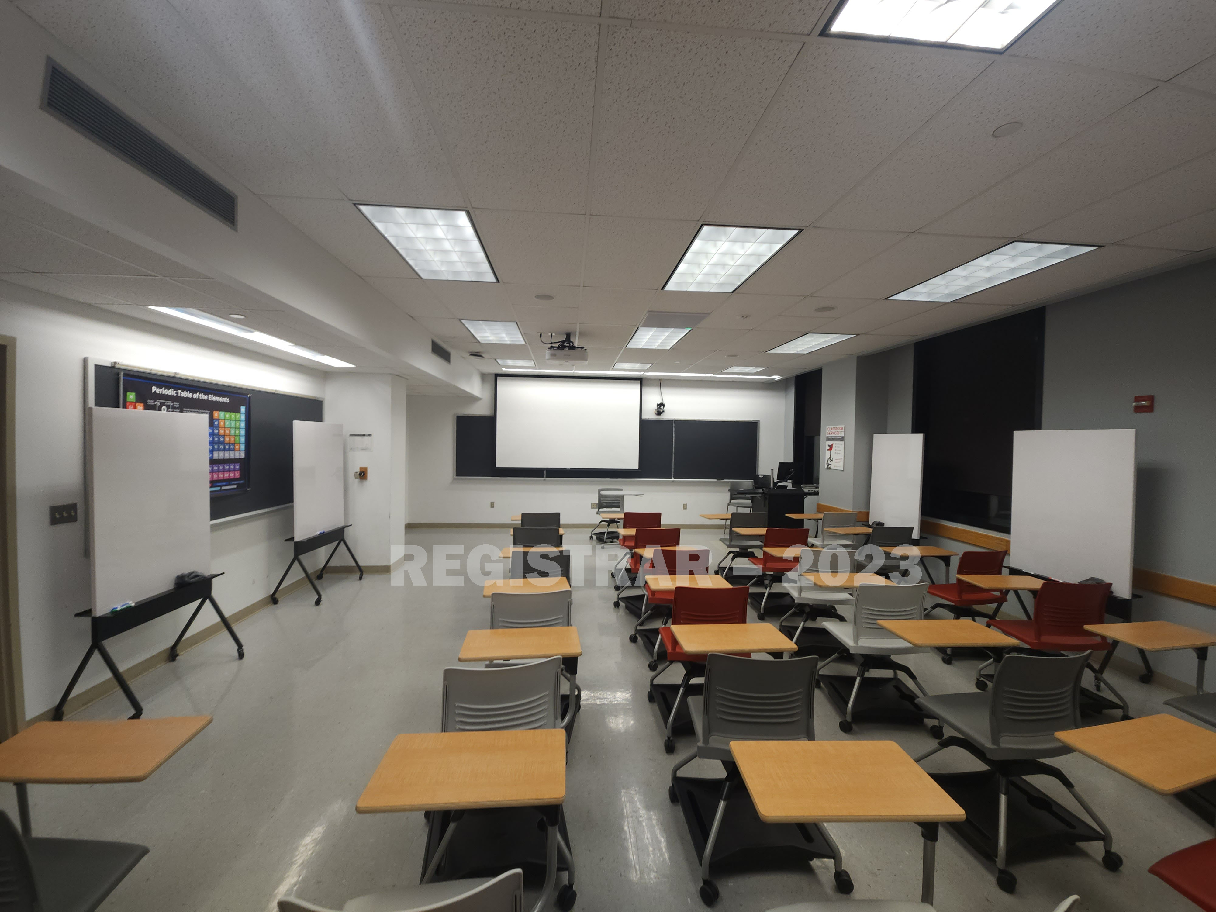 McPherson Chemical Lab room 1041 ultra wide view from the back of the room with projection screen down