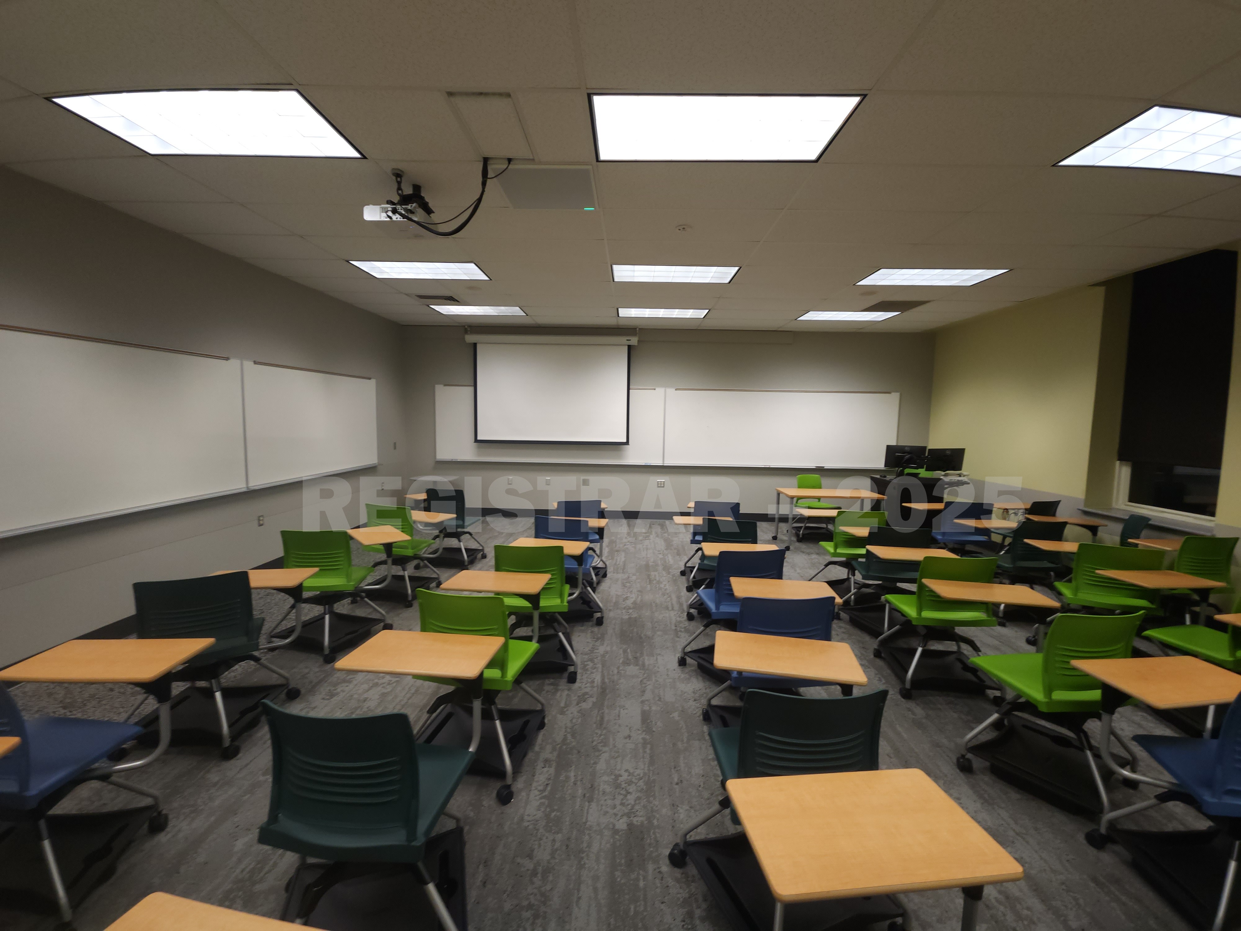 Mendenhall Laboratory room 173 view from the back of the room with projector screen down