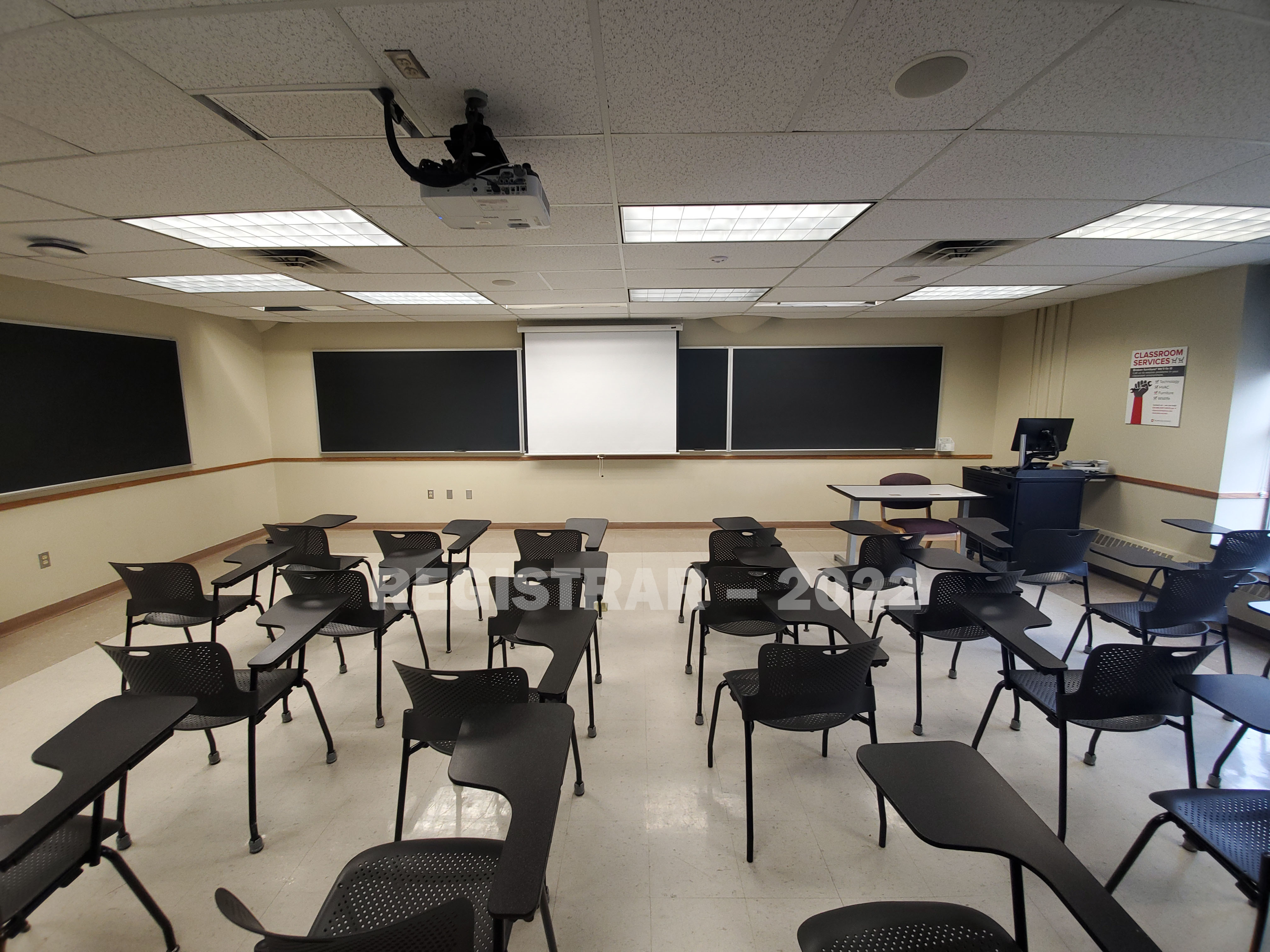 Enarson Classroom Building room 226 ultra wide angle view from the back of the room with projector screen down