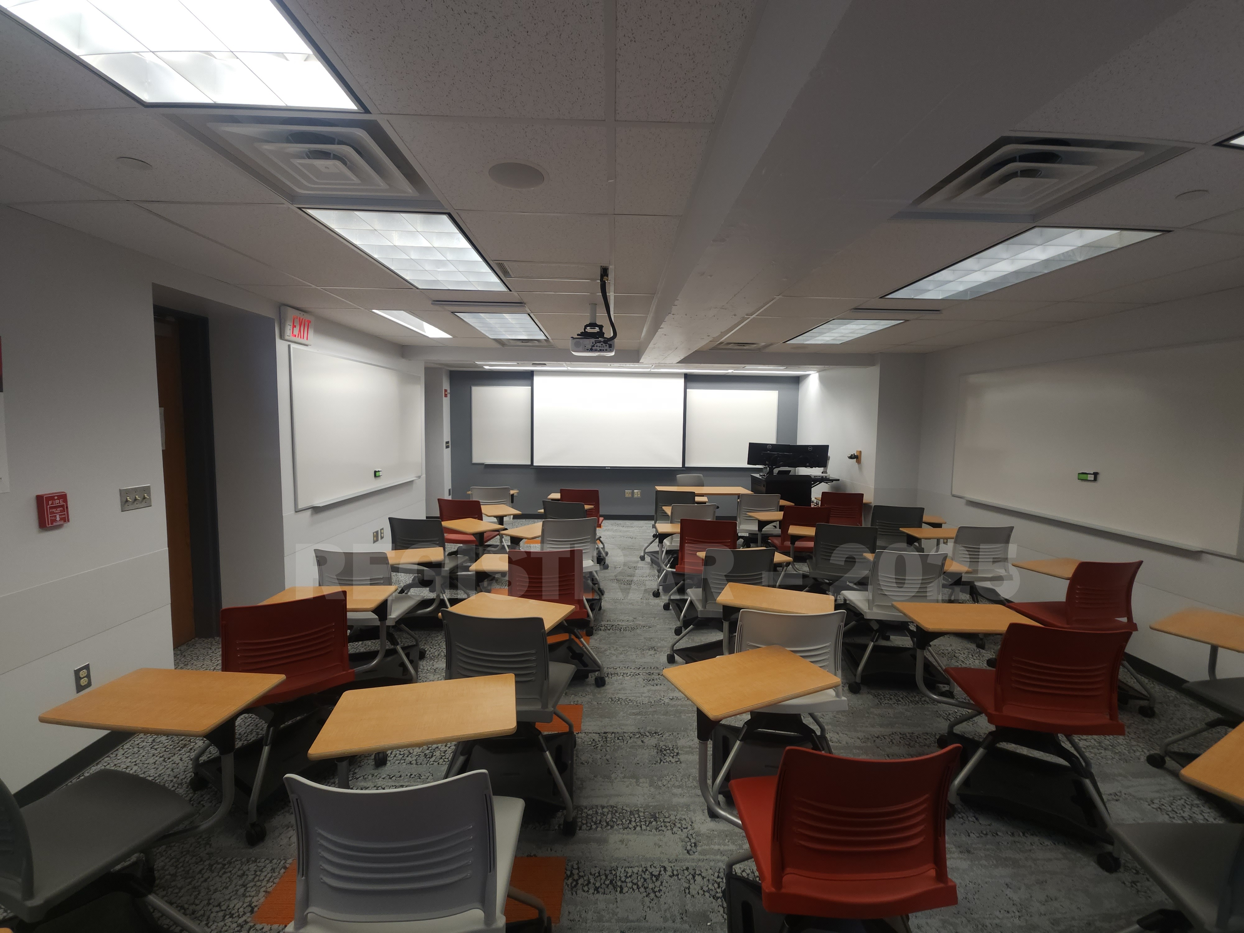 McPherson Chemical Lab room 1008 ultra wide angle view from the back of the room with the projector screen down