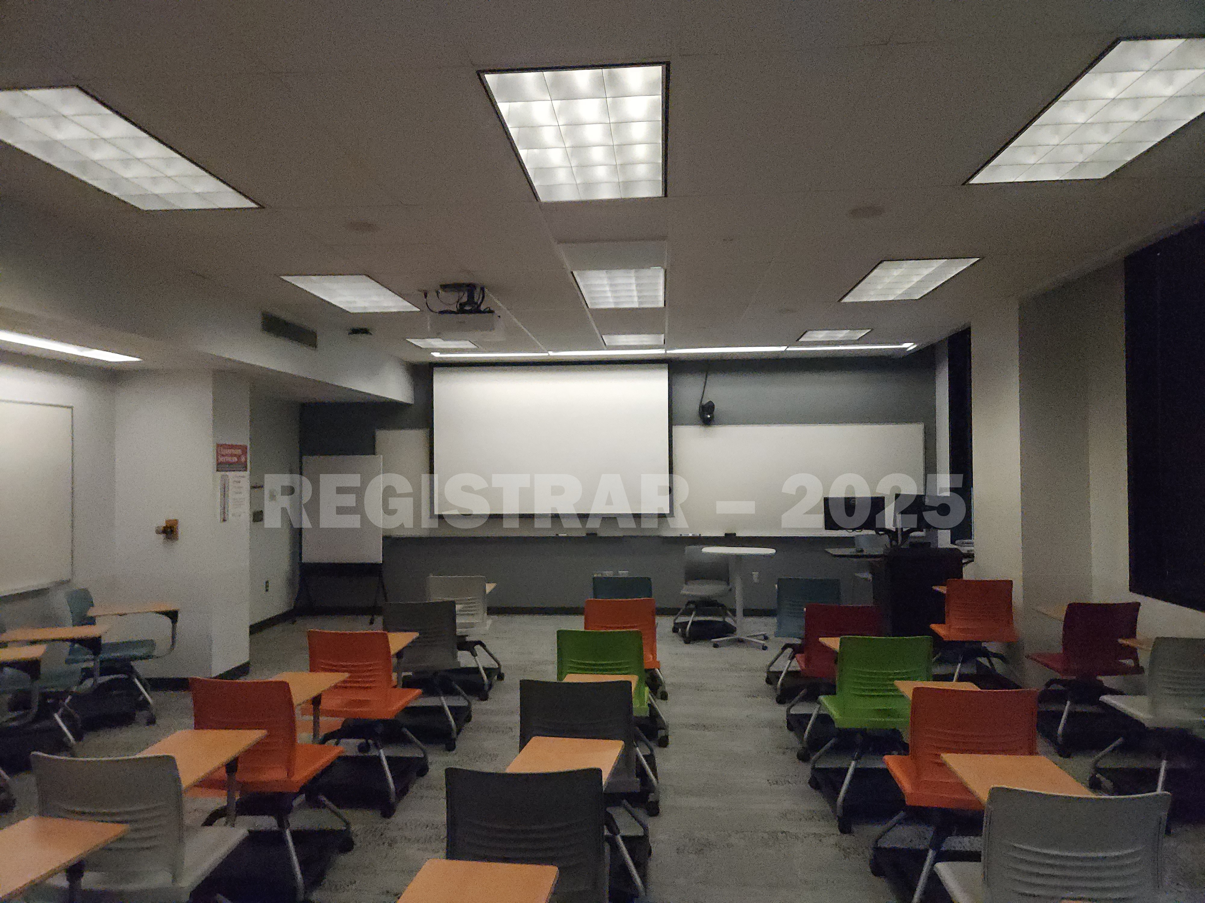 McPherson Chemical Lab room 1041 view from the back of the room with projection screen down