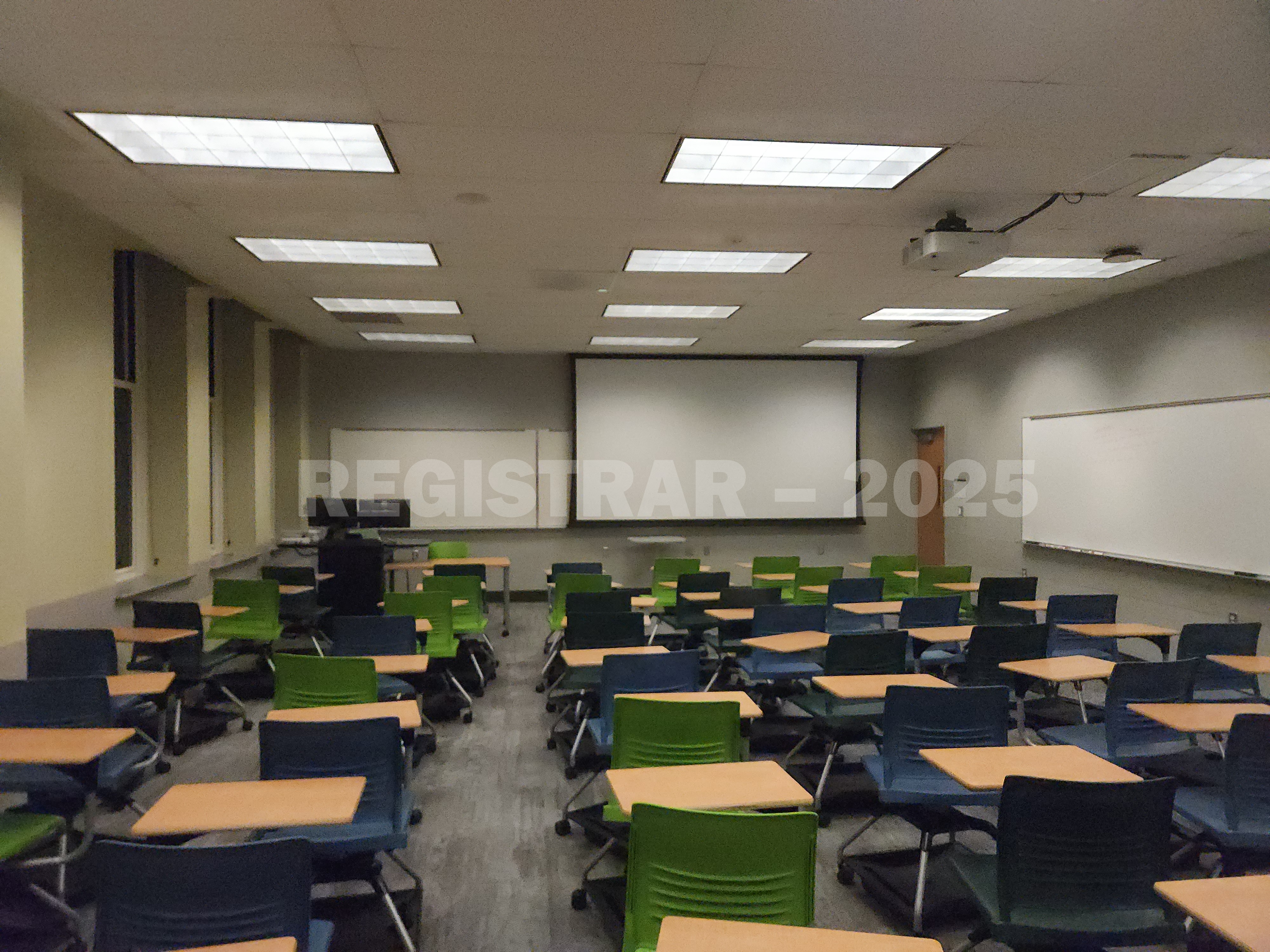 Mendenhall Laboratory room 191 view from the back of the room with projector screen down