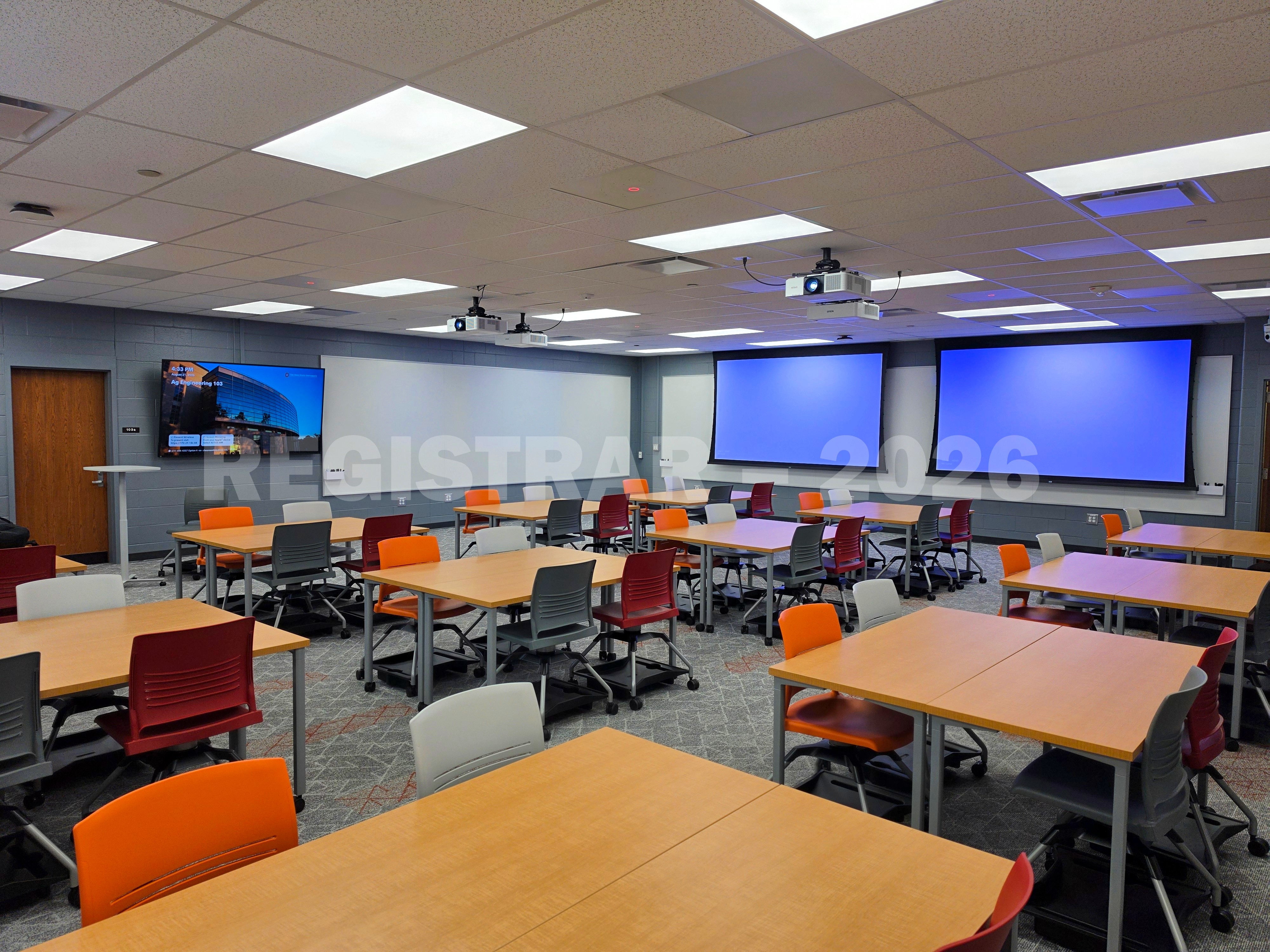 Agricultural Engineering Building room 103 view from the front of room with projector screen down  in the right corner