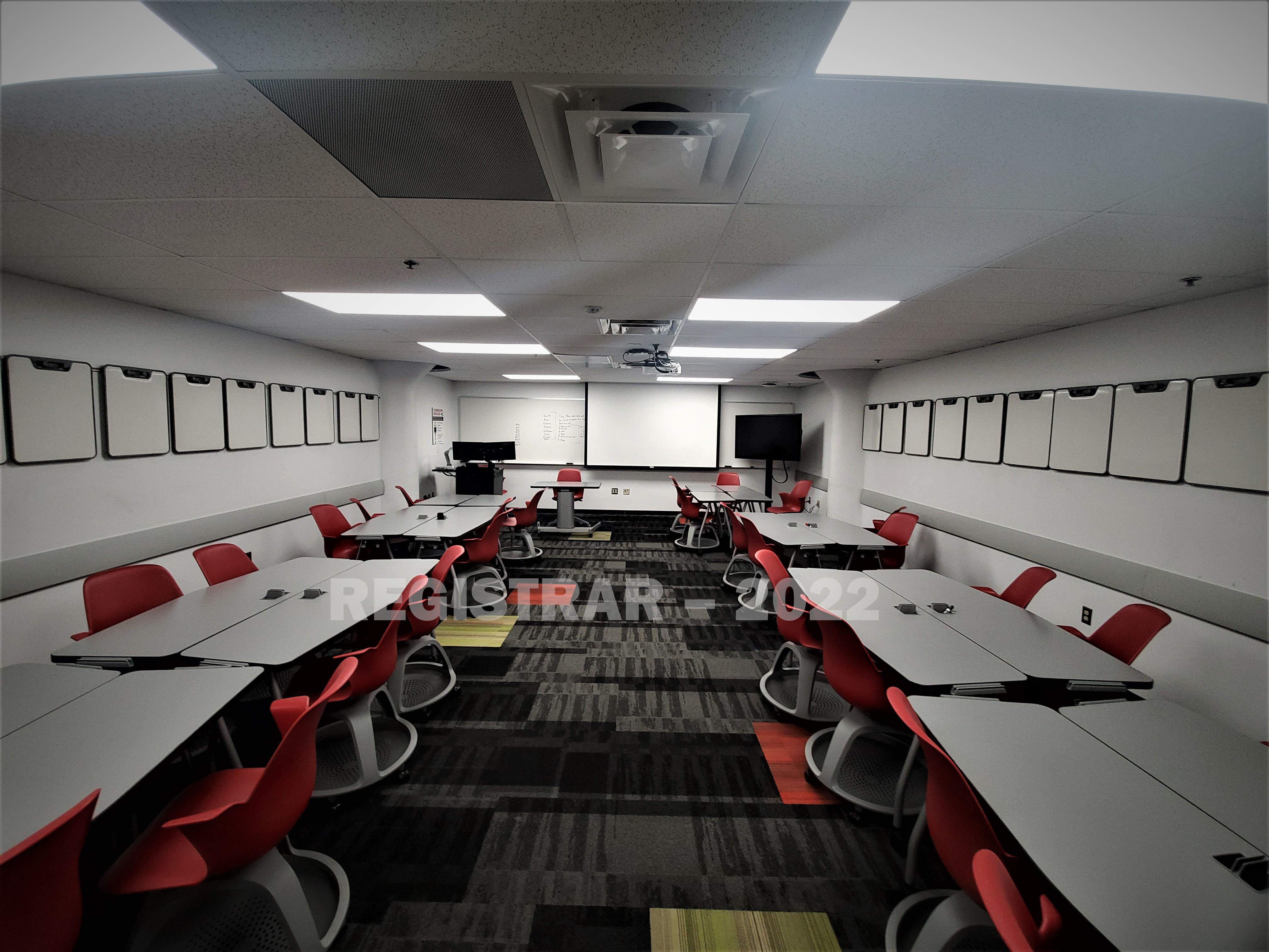 Enarson Classroom Building room 14 ultra wide angle view from the back of the room with projector screen down