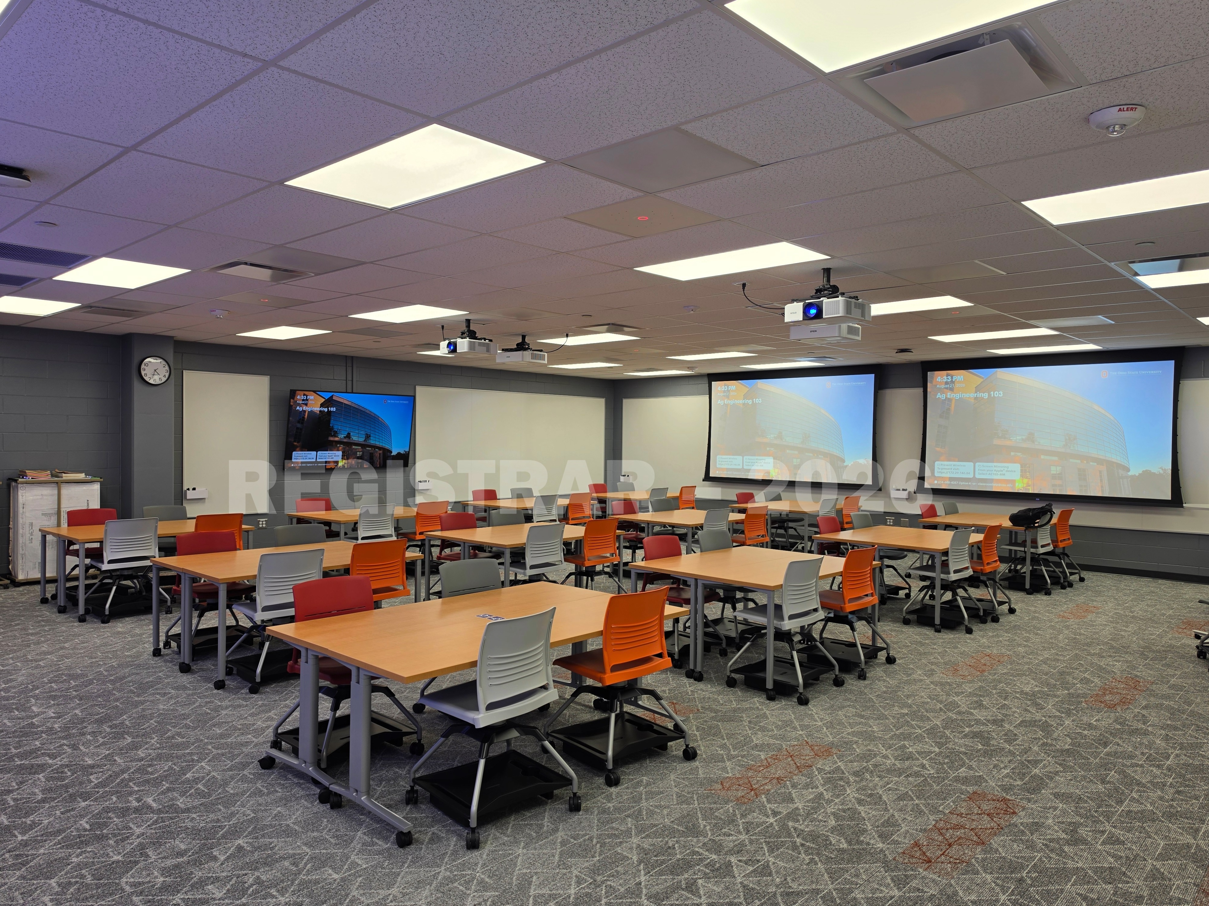 Agricultural Engineering Building room 103 view from the back of room with projector screen down  in the right corner