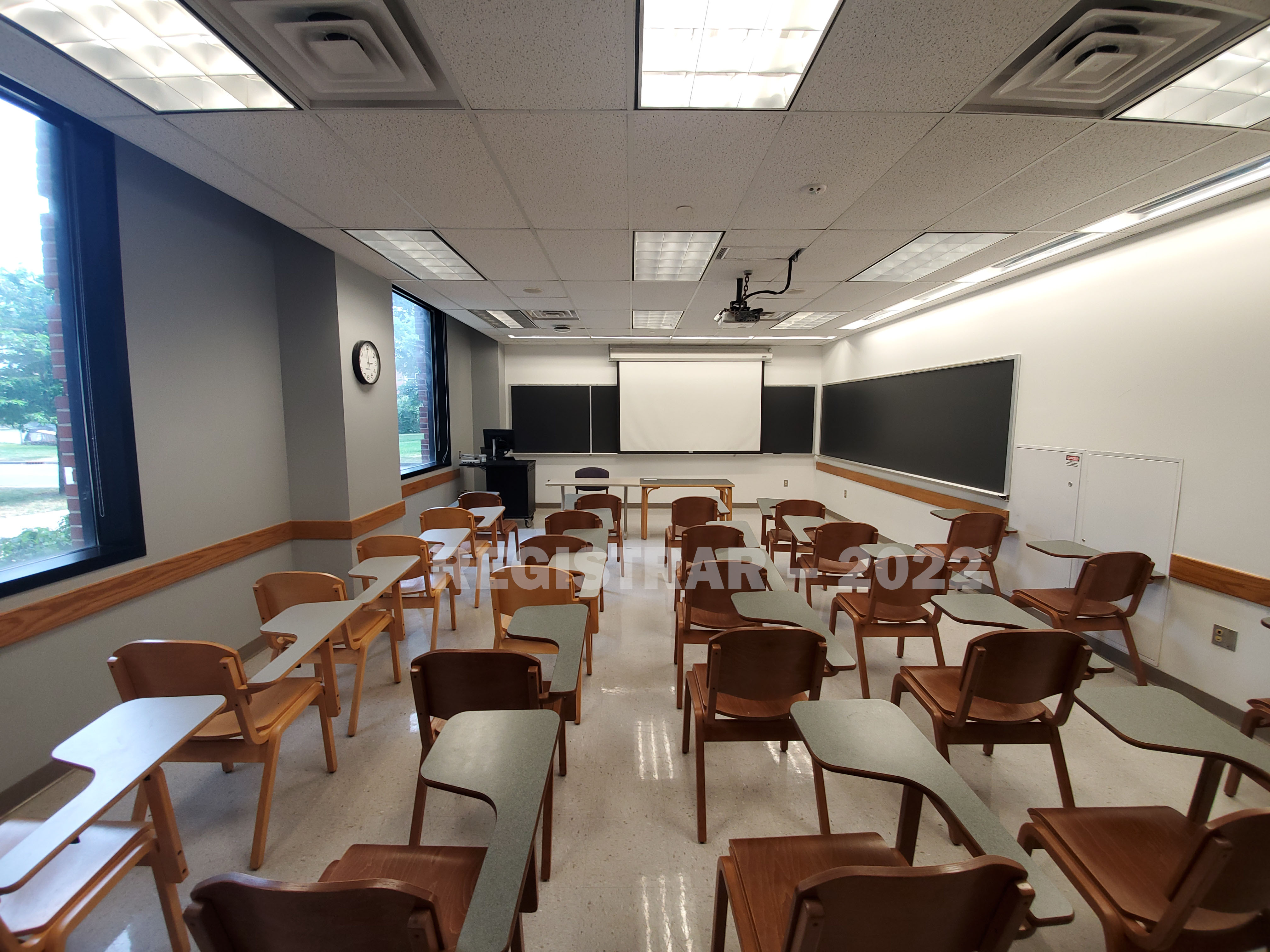 McPherson Chemical Lab room 1005 ultra wide angle view from the back of the room with projector screen down