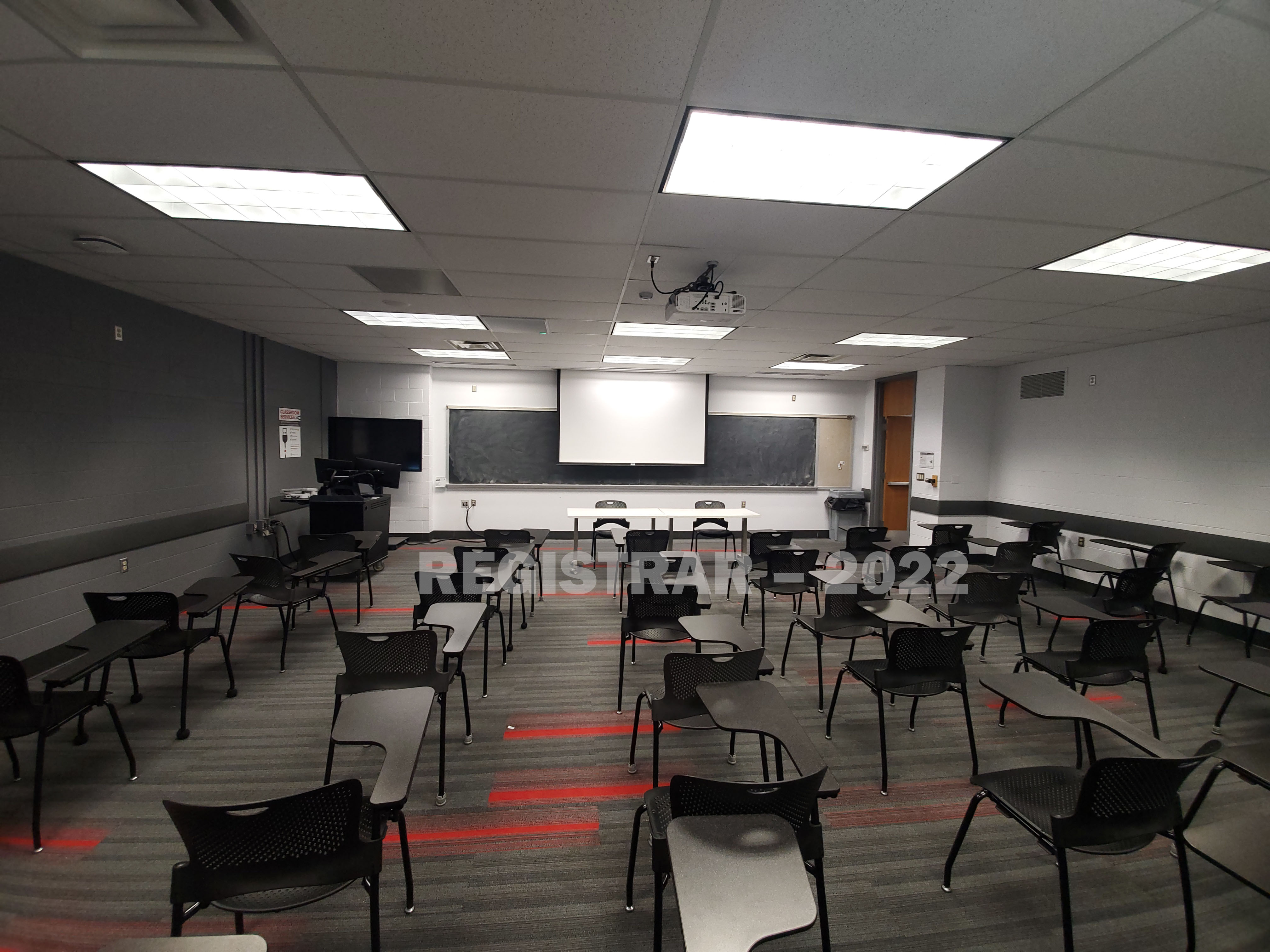 Baker Systems Engineering room 180 ultra wide angle view from the back of the room with projector screen down