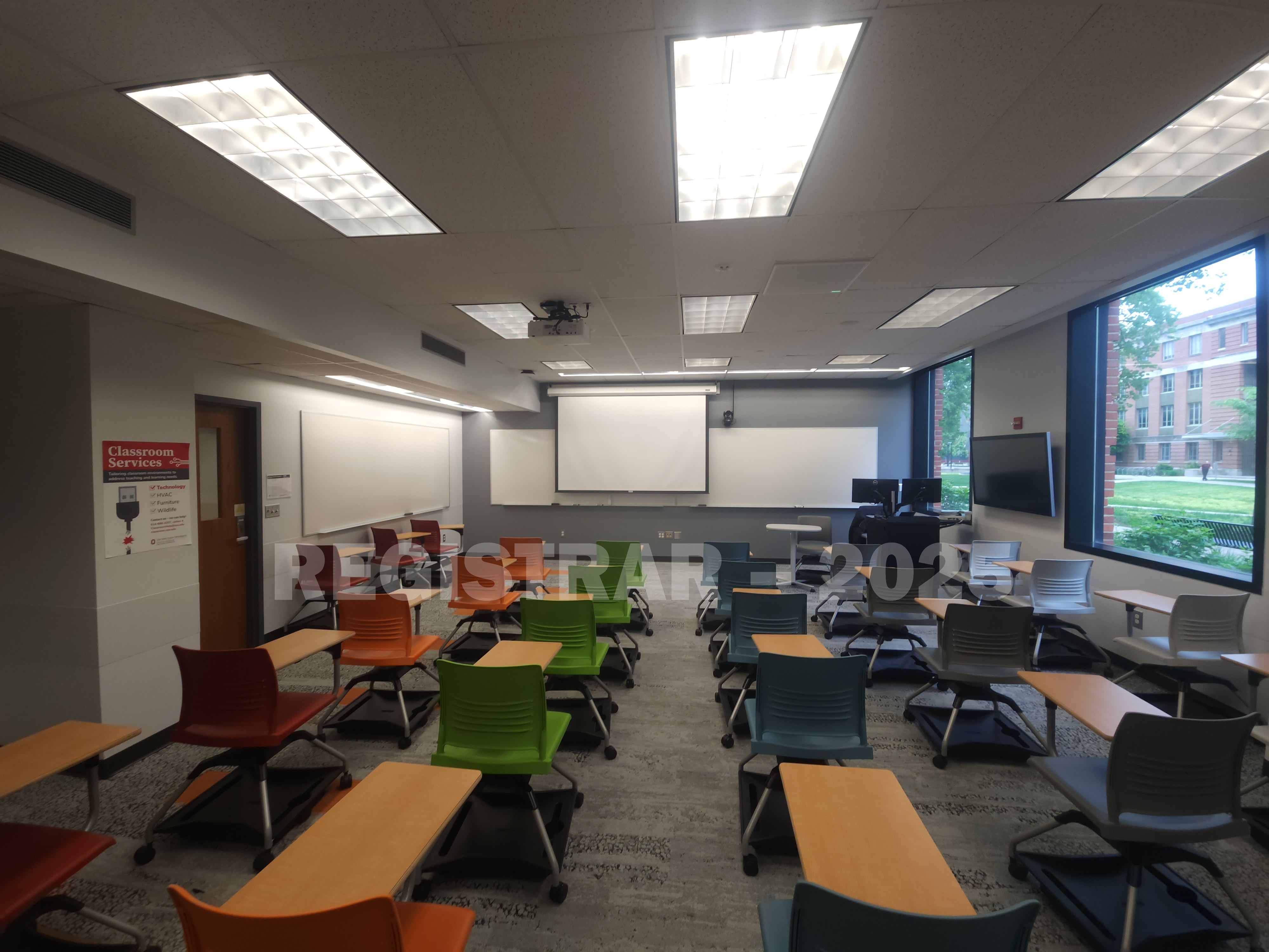 McPherson Chemical Lab room 1045 ultra wide view from the back of the room with projection screen down