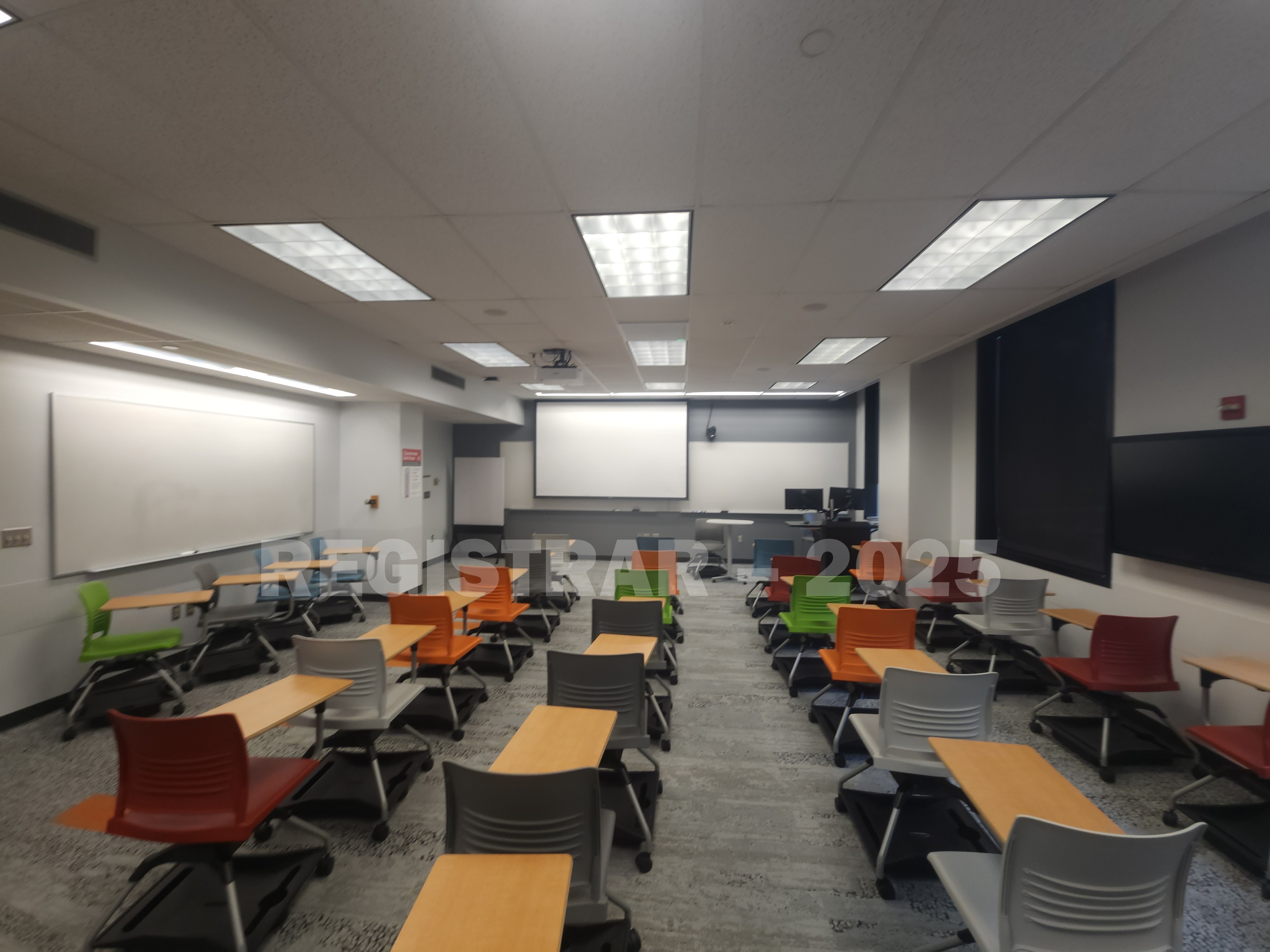 McPherson Chemical Lab room 1041 ultra wide view from the back of the room with projection screen down