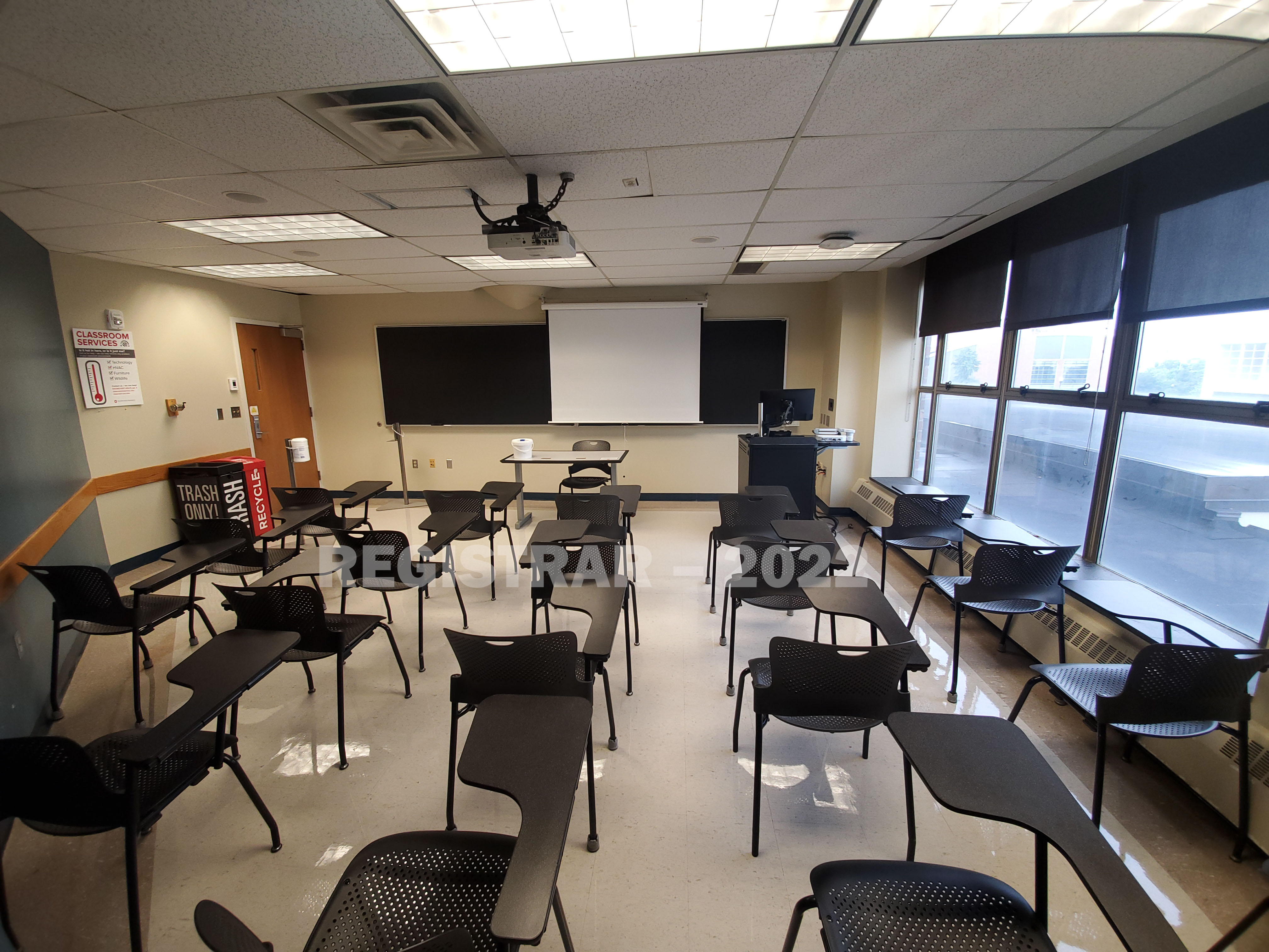 Enarson Classroom Building room 238 ultra wide angle view from the back of the room with projector screen down