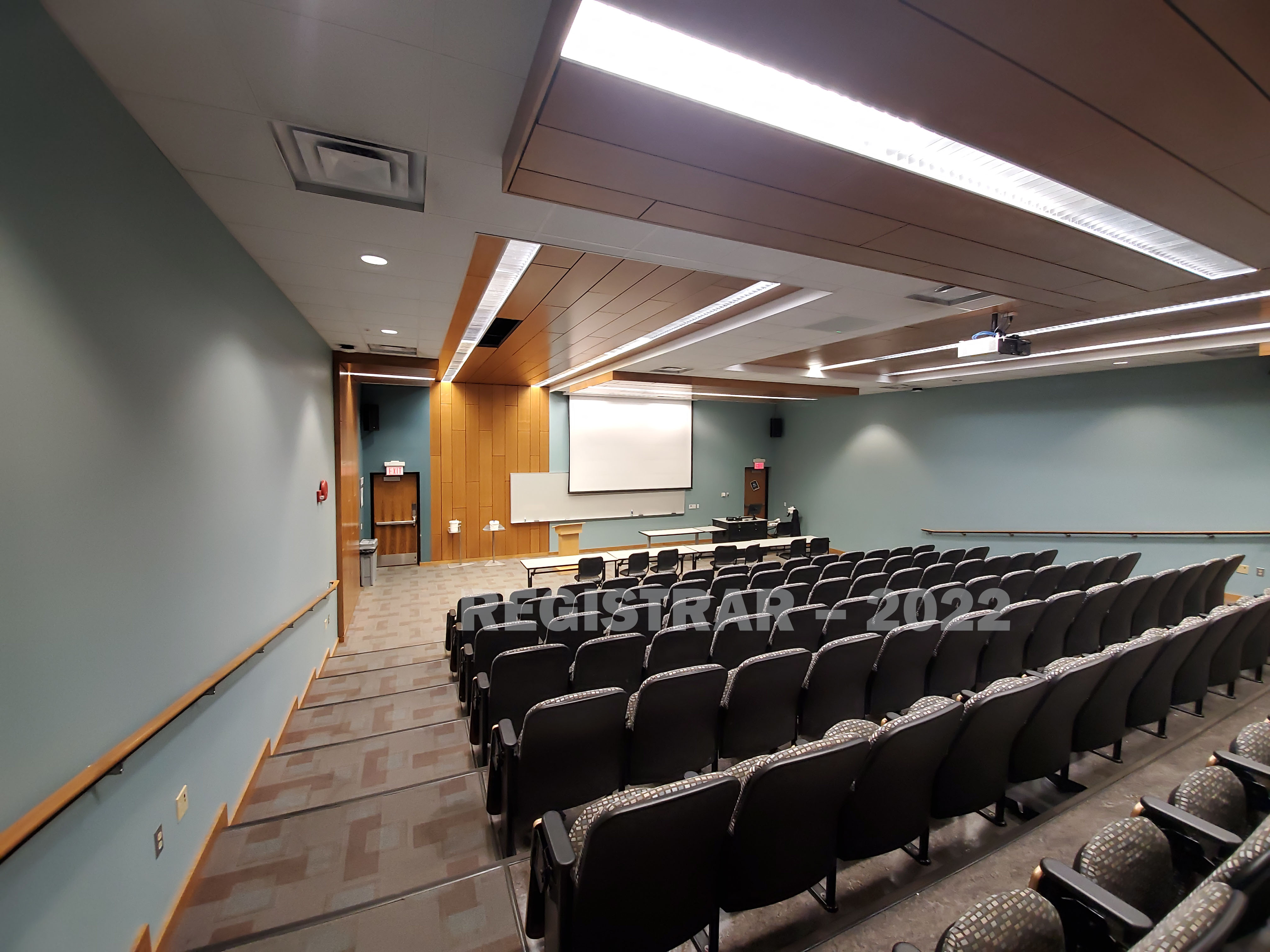 Journalism Building room 360 ultra wide angle view from the back of the room with projector screen down