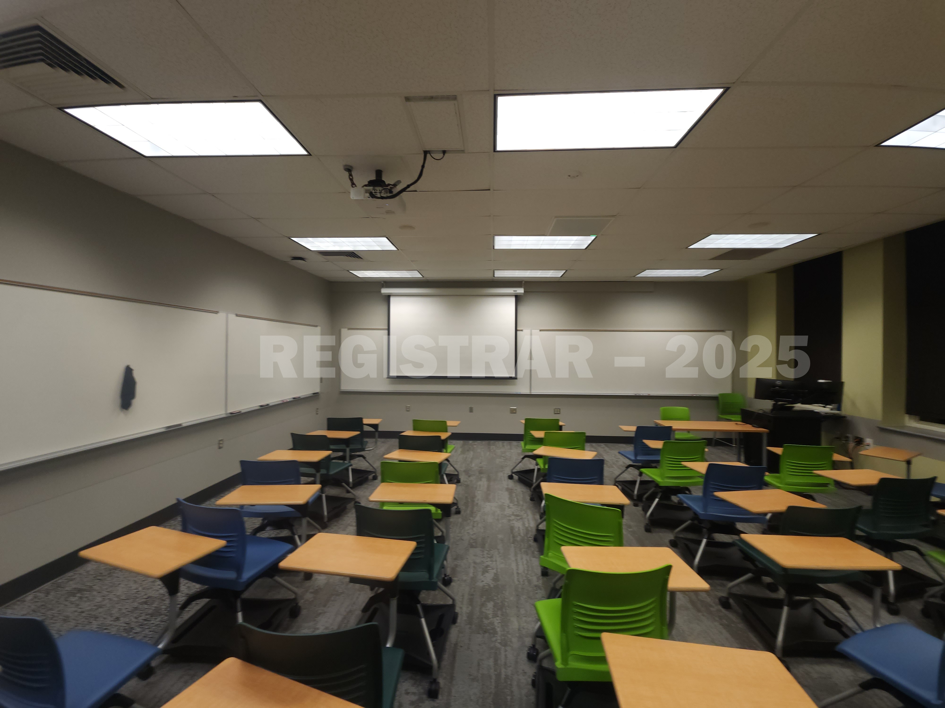 Mendenhall Laboratory room 129  ultra wide angle view from the back of the room with projector screen down