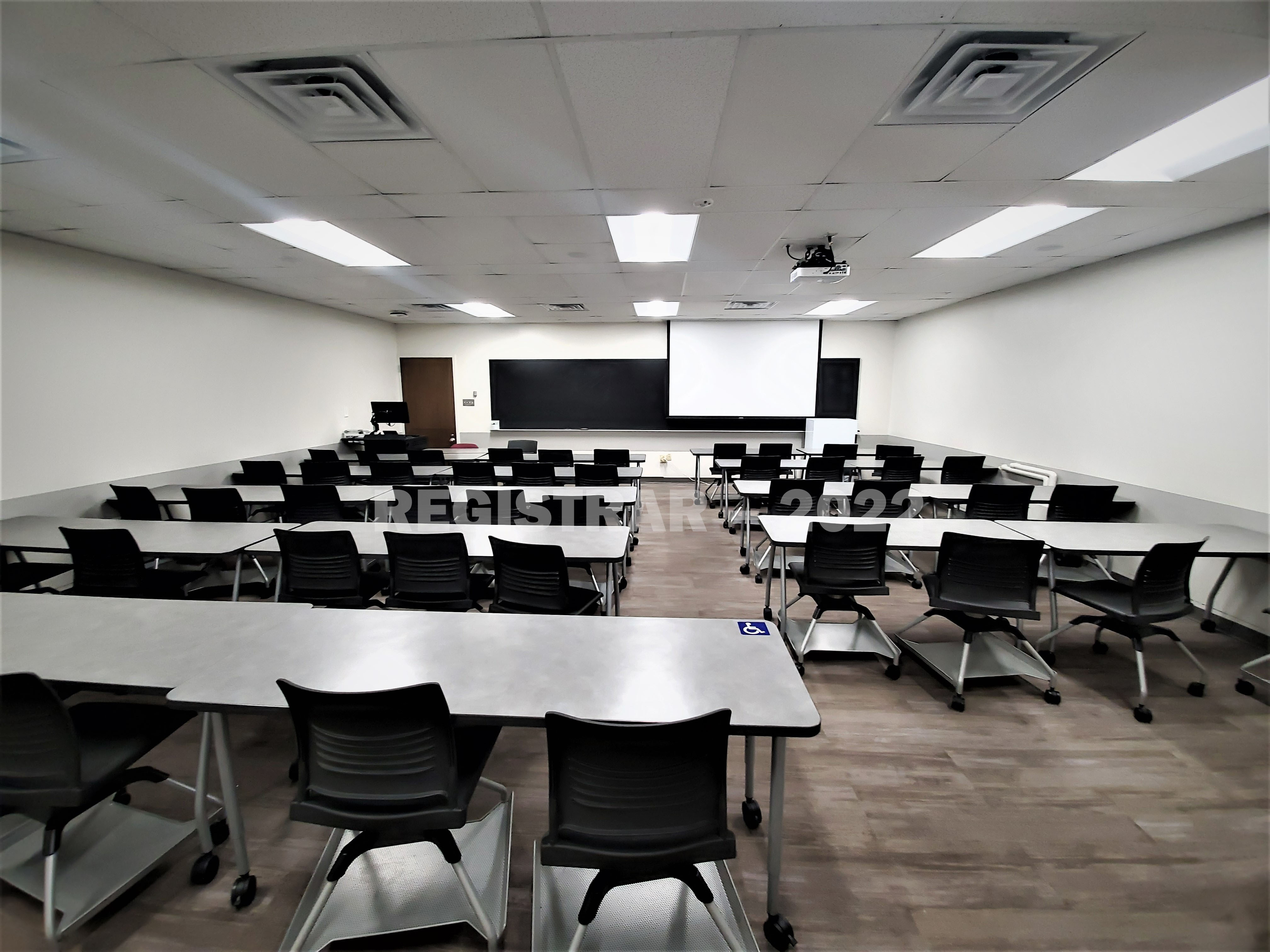 Dreese Lab room 357 ultra wide angle view from the back of the room with projector screen down