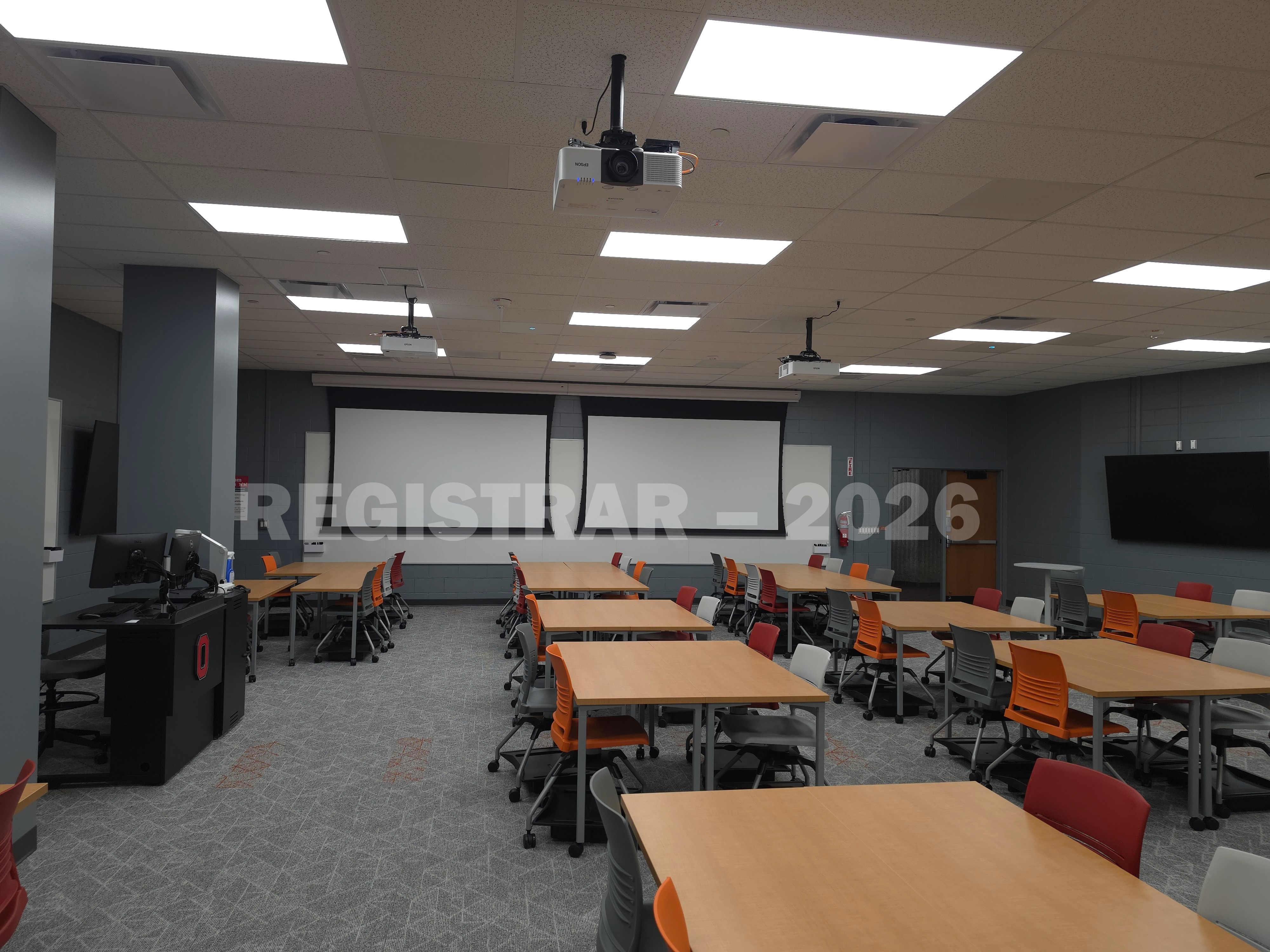 Agricultural Engineering Building room 100 view from the right side of the room with the projector screens down